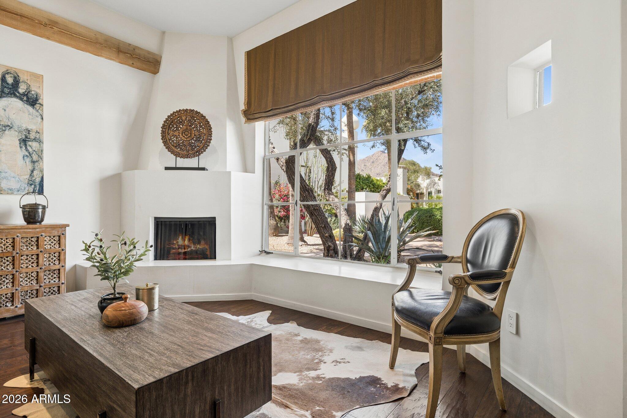 Paradise Valley's highly sought after & fabled Casa Blanca, located at the base of Camelback Mountain, is a resort-style community dating back to the 1930's. This rare, highly coveted & light-filled single level centrally-located unit w/ mountain views from the living areas is timelessly up-to-date w/ top of the line finishes.  Featured are 10 ft. ceilings w/exposed beams, hickory flooring, European cabinetry, Spanish marble, Viking gas range, Subzero fridge, gas fireplace. Large east facing rear patio is just steps from the main pool & glorious rose garden. 24 hour guard-gated community. 22 acres featuring 3 heated pools, tennis/pickleball courts & meandering walking paths.  Located just minutes from hiking, golf, Fashion Square shopping & dining. Truly a special property.