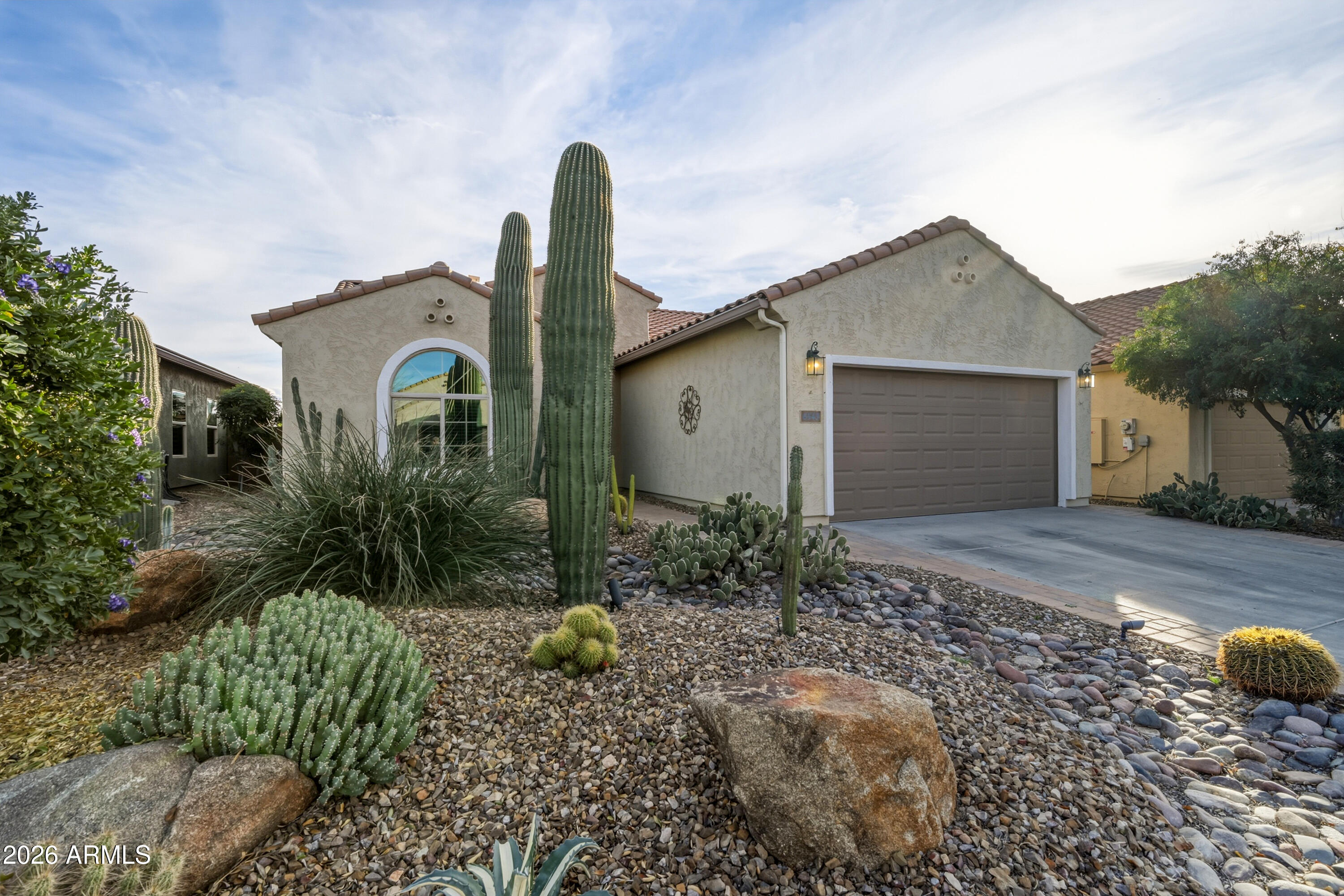 This 2012 Senita model by Pulte in Parkside Anthem at Merrill Ranch offers 3 bedrooms, 2 baths, and a split floor plan with den and built-in Murphy bed. The upgraded kitchen features professionally painted cabinets with new hardware, quartz countertops, stainless steel appliances, newer refrigerator and microwave, gas stove, R/O system, and new gas hot water heater. Open living area includes 9+ flat ceilings, 6 inch baseboards, surround sound, and upgraded electric fireplace in the entertainment center. Primary suite has walk-in closet/dressing room, soaking tub, shower, and double sinks. South facing backyard with covered patio, pavers, gas firepit, built-in outdoor kitchen, spa, and desert landscaping on 6,098 sqft lot bordering preserved land. Live in a resort in Anthem at Merrill Ranch and enjoy the waterpark, lap pool with diving well, workout facility, tennis, golf, pickleball, soccer fields, sand volleyball, softball fields, walking trails, dog park, catch and release fishing, playgrounds, the Anthem Grille Restaurant and much more! HOA fees include common area maintenance, amenities and resident golf rates.