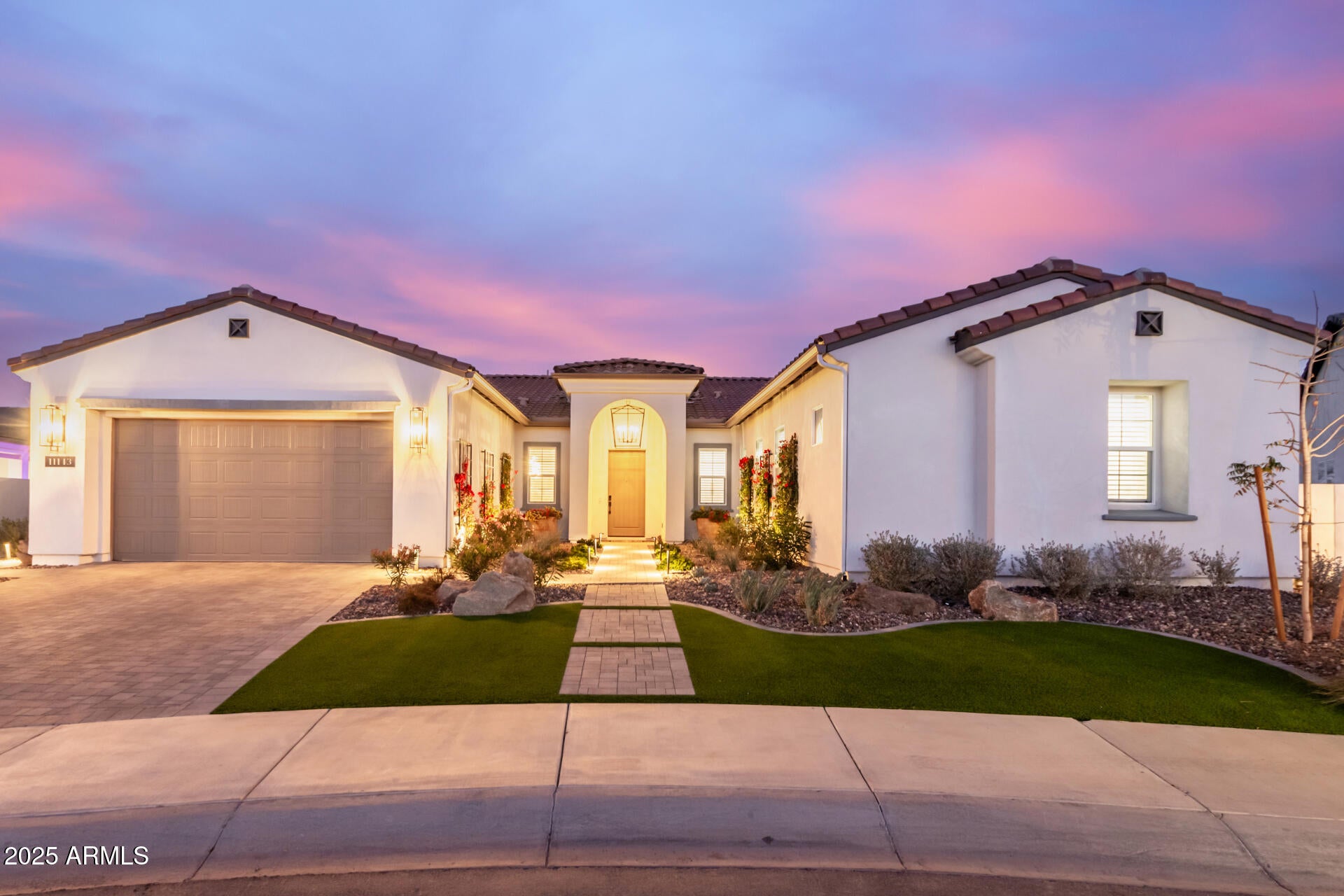 This highly popular Rutherford-model house in Sterling Grove has it all. One of the best locations (near the 18th hole and just a short walk to the restaurant/fitness/spa/clubhouse), massively upgraded, incredible custom pool/spa with soothing waterfall features, and a beautifully landscaped oversized premium lot with no neighbors directly behind. The kitchen is beautifully designed with upgraded floor-to-ceiling cabinets, luxurious quartz countertops, and Jenn-Aire kitchen appliances, including a built-in refrigerator with custom wood panels matching the cabinets, and a 48' double-oven/range with 6-burner gas stove and griddle. The living room boasts a beautiful natural stone gas fireplace with a unique rustic wood mantle. Upgraded 16' sliders open to a stunning backyard where you... Upgraded 16' sliders open to a stunning backyard where you will enjoy multiple outdoor sitting areas, including a custom built-in 8' gas fire pit, a large covered patio with 2 ceiling fans for the summer and 2 electric heaters for the winter, a full-sun lounge area, and a covered cabana. The large pool includes a Baja shelf, 3 waterfalls with copper scuppers, an in-water bench along the back length, and a large hot tub with spillways into the pool. The master bedroom includes a large bathroom with a walk-in rain shower, double vanity, large soaking tub, and a Japanese-style toilet. The guest bedrooms are all ensuite with walk-in closets. This house also features an office room with built-in cabinets and an oversized butler pantry with custom floor-to-ceiling cabinets. The garage has a separate mini-split with AC and heat and an epoxy floor. Additional features in the home include all new lighting (including new LED can ceiling lights), upgraded faucets, custom window shades throughout, all new solid-core interior doors, sink and cabinets in the laundry room, recirculating hot water system, water softener, and much, much more!
