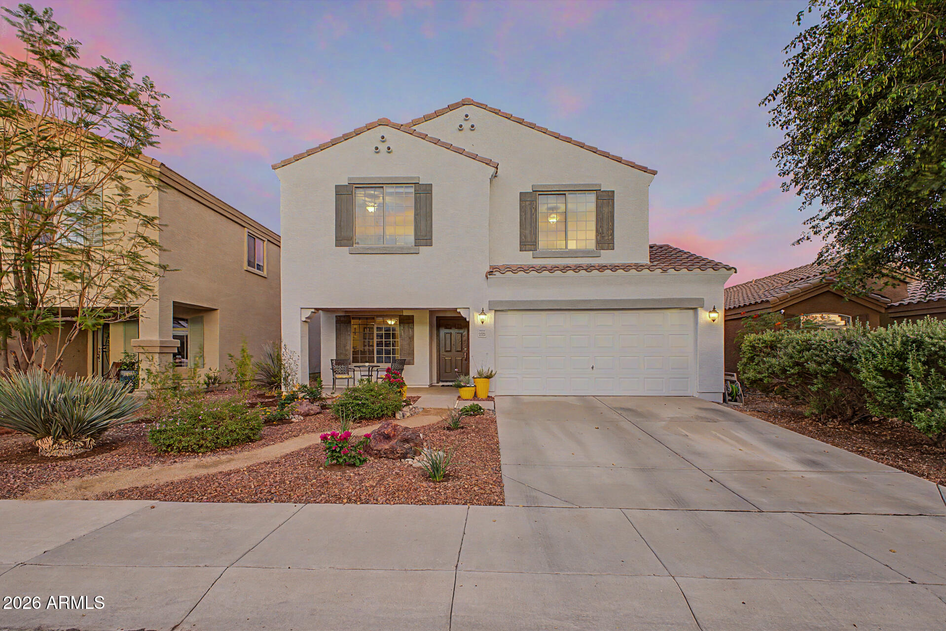 NOT an age-restricted community -- Sun City mailing address only. This beautifully maintained home offers standout curb appeal with a welcoming front porch and thoughtfully designed landscaping. Situated on an elevated lot, the property backs to a serene desert common area, providing privacy. Inside, you'll find 3 bedrooms and 3 full bathrooms, along with a versatile flex room perfect for a home office, gym, or additional living space. The entry opens to stylish tile flooring, neutral tones, and upgraded finishes that carry throughout the home. The spacious main living area is filled with natural light and features a full wall of stunning built-in shelving that seamlessly flows to the dining area and kitchen--ideal for both everyday living and entertaining. The kitchen is a standout, showcasing abundant upgraded 42-inch custom cabinetry, modern hardware, quartz countertops, stainless steel appliances, a pantry, and recessed lighting. Upstairs, an expansive loft provides additional living space for relaxing or entertaining. The large primary suite features a double-door entry, a walk-in closet, and an en-suite bathroom with dual sinks. Secondary bedrooms are generously sized, and the convenience of an upstairs laundry room adds to the home's thoughtful layout. Step outside to an oversized backyard designed for entertaining, complete with a covered patio and multiple seating spaces. The desert landscaping is enhanced with added greenery and artificial turf, creating a low-maintenance yet inviting outdoor retreat. Residents enjoy access to a community park featuring tennis courts, basketball, and volleyball courts--perfect for an active lifestyle.
