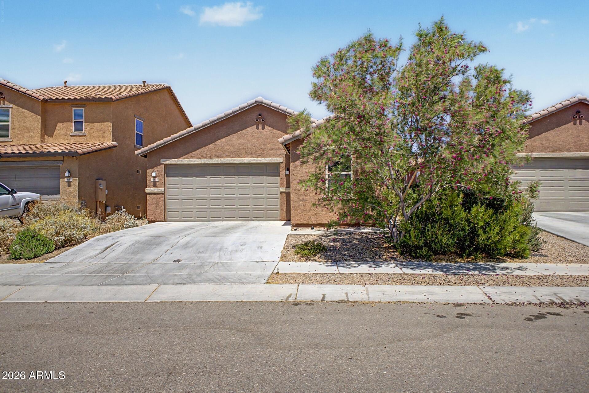 Single-family home in Sonoran Ranch Estates built in 2020 offering a functional 3 bedroom plus versatile den that can serve as a home office, gym, or potential 4th bedroom. Open-concept living area features abundant natural light and flows into a well-equipped kitchen with island, pantry, and gas appliances. Low-maintenance backyard with upgraded pavers and covered patio provides a clean outdoor space for relaxing or entertaining. Additional features include tile roof, dual-pane windows, refrigerated A/C, and 2-car attached garage. Located in a quiet residential setting within Tucson Unified School District with convenient access to schools, shopping, and major roadways. Competitively priced and move-in ready.