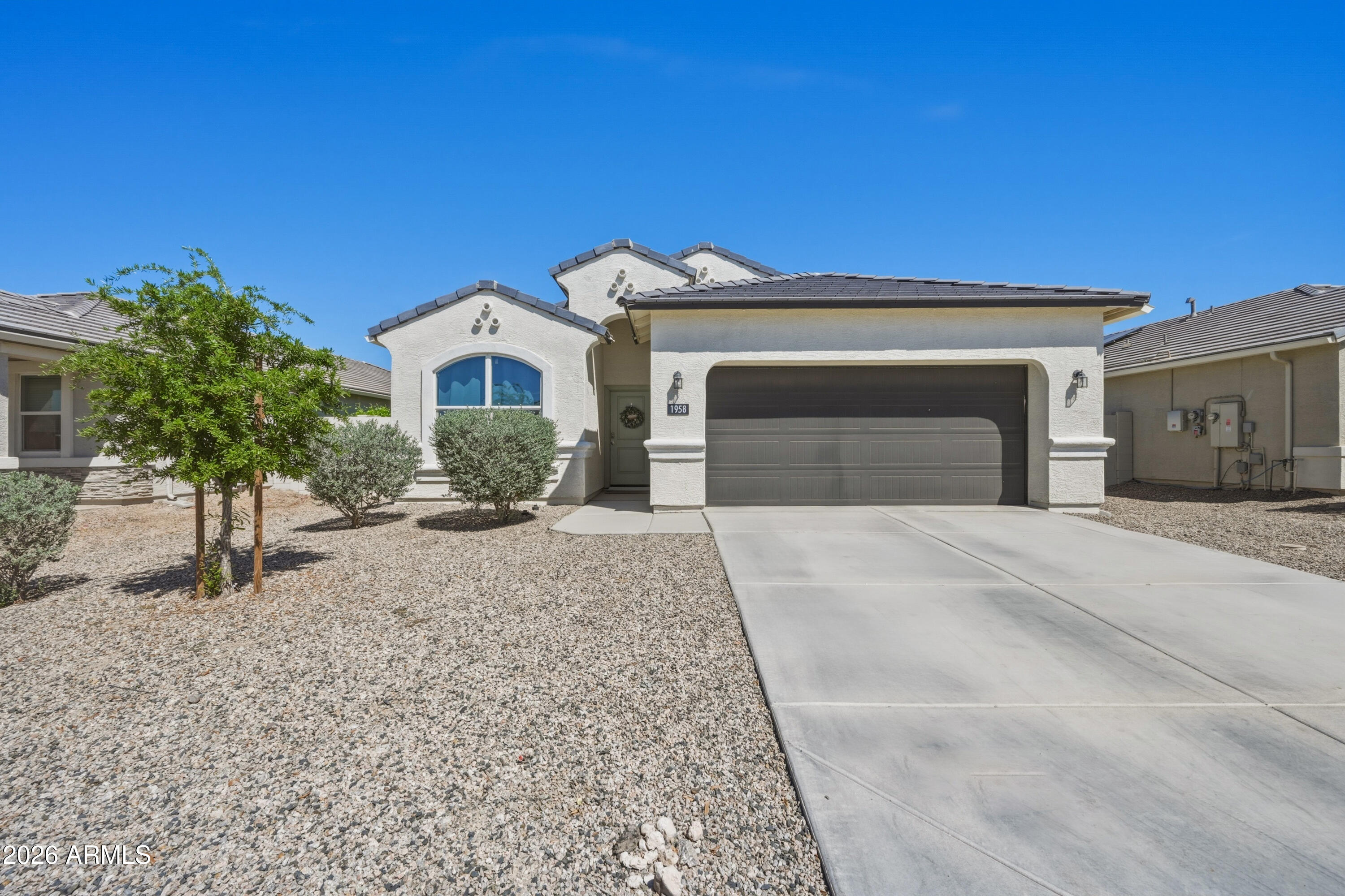 ASSUMABLE 2.5% MORTGAGE! Built in 2020 and well maintained, this 4 bed, 2 bath home offers 1,559 sq ft of bright, functional living space. The open layout connects the living area to the kitchen, ideal for entertaining or everyday living. Features include tile flooring, 9 ft ceilings, double pane windows, and modern finishes throughout. The backyard is ready to enjoy with a covered patio and extended pavers, and grass, perfect for relaxing or hosting. Upgrades include a smart home system and ceiling fans in every room and on the patio. A neutral color palette adds style. Located near Heartland Ranch Elementary with easy access to nearby amenities, this move in ready home offers comfort and value. Seller will pay off solar with an acceptable offer.