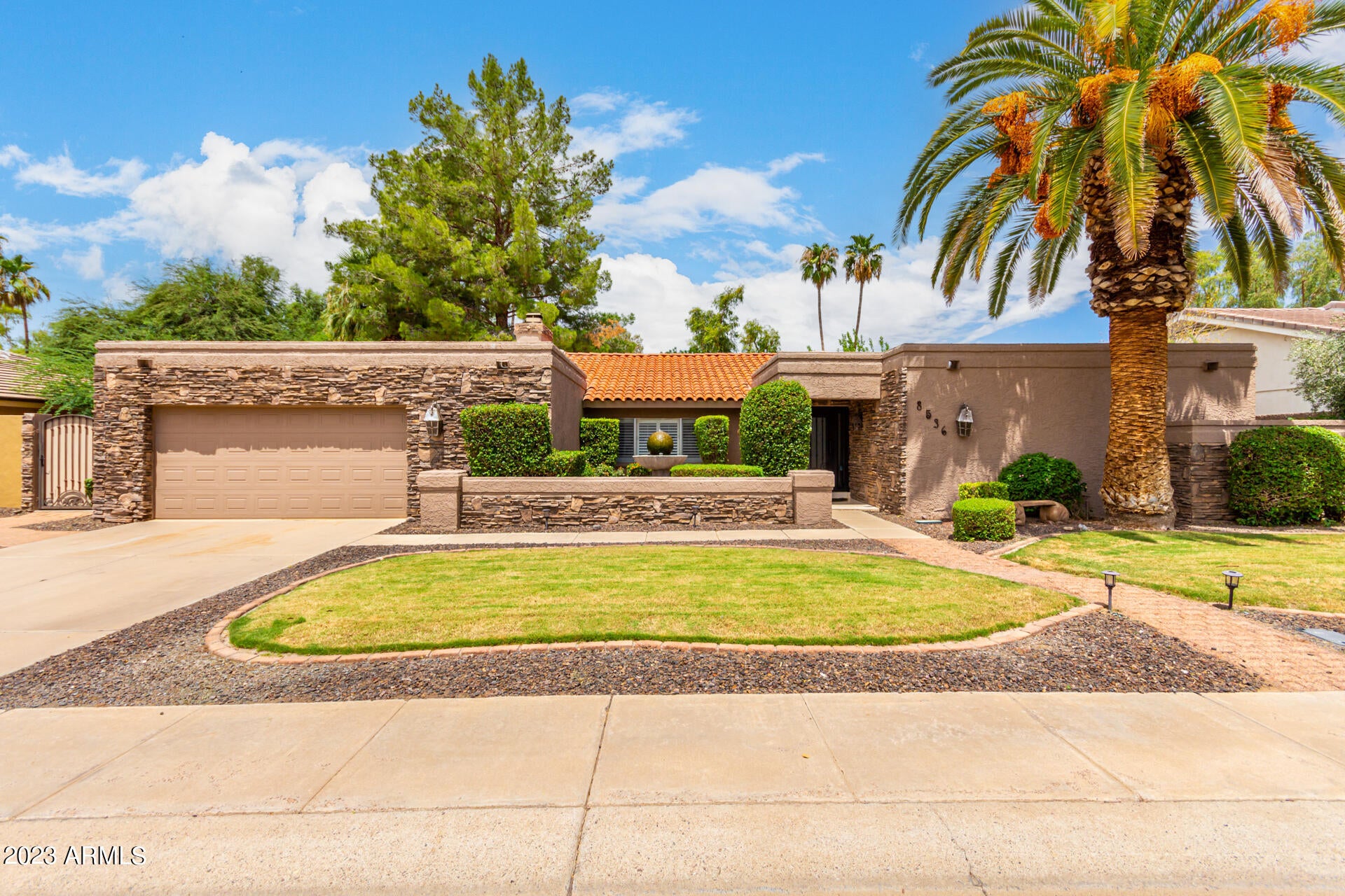The ULTIMATE LOT on GREENBELT in McCormick Ranch! Amazing deep lot with no neighbors behind you! New interior paint, carpet/pad July 2022. Enormous pebble-tec diving pool with slide was expanded with play area and baja step! Pool is offset in yard, plenty of grass & shade trees & room to expand or build guest house! Golden Heritage most popular floor plan! Vaulted family room, split master bedroom, large guest bedrooms. Expanded covered enclosed patio perfect for entertaining or hobby room. Solid block construction. Enjoy miles of trails to walk, bike along mature trees & grass pathways! 3rd lot from cul-de-sac greenbelt. The best lifestyle for your family in the center of Scottsdale!