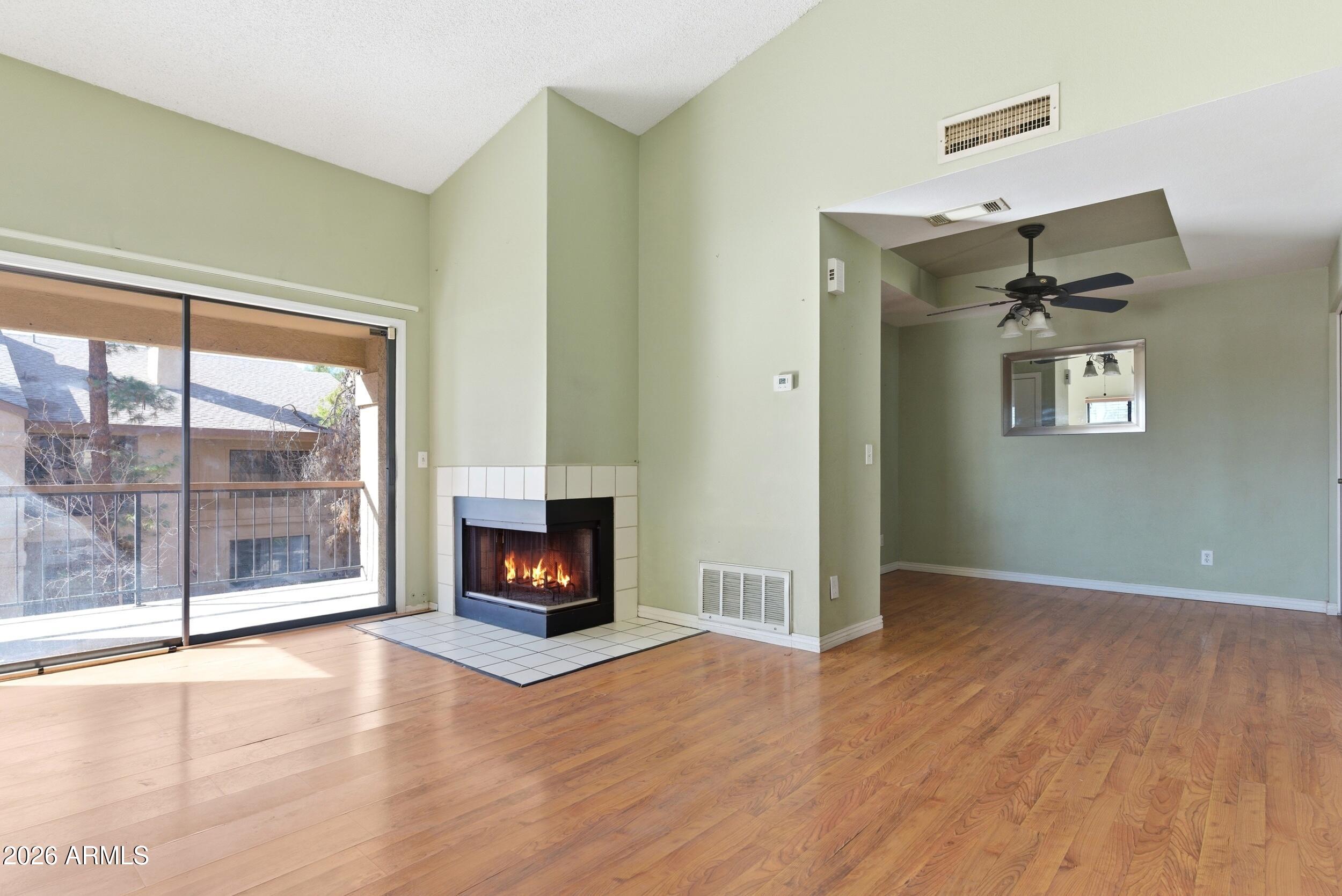 This charming 1 bed, 1 bath condo is located on the second floor and features a cozy fireplace, wood like vinyl flooring, and a great view overlooking the community lake. Enjoy access to a sparkling community pool and the convenience of a dedicated garage space. The open living area is filled with natural light, creating a warm and inviting atmosphere. The HOA covers water, sewer, and garbage, adding extra value and ease of living. Whether you're relaxing by the fire or taking in the peaceful water views, this home delivers comfort and charm in a great setting.