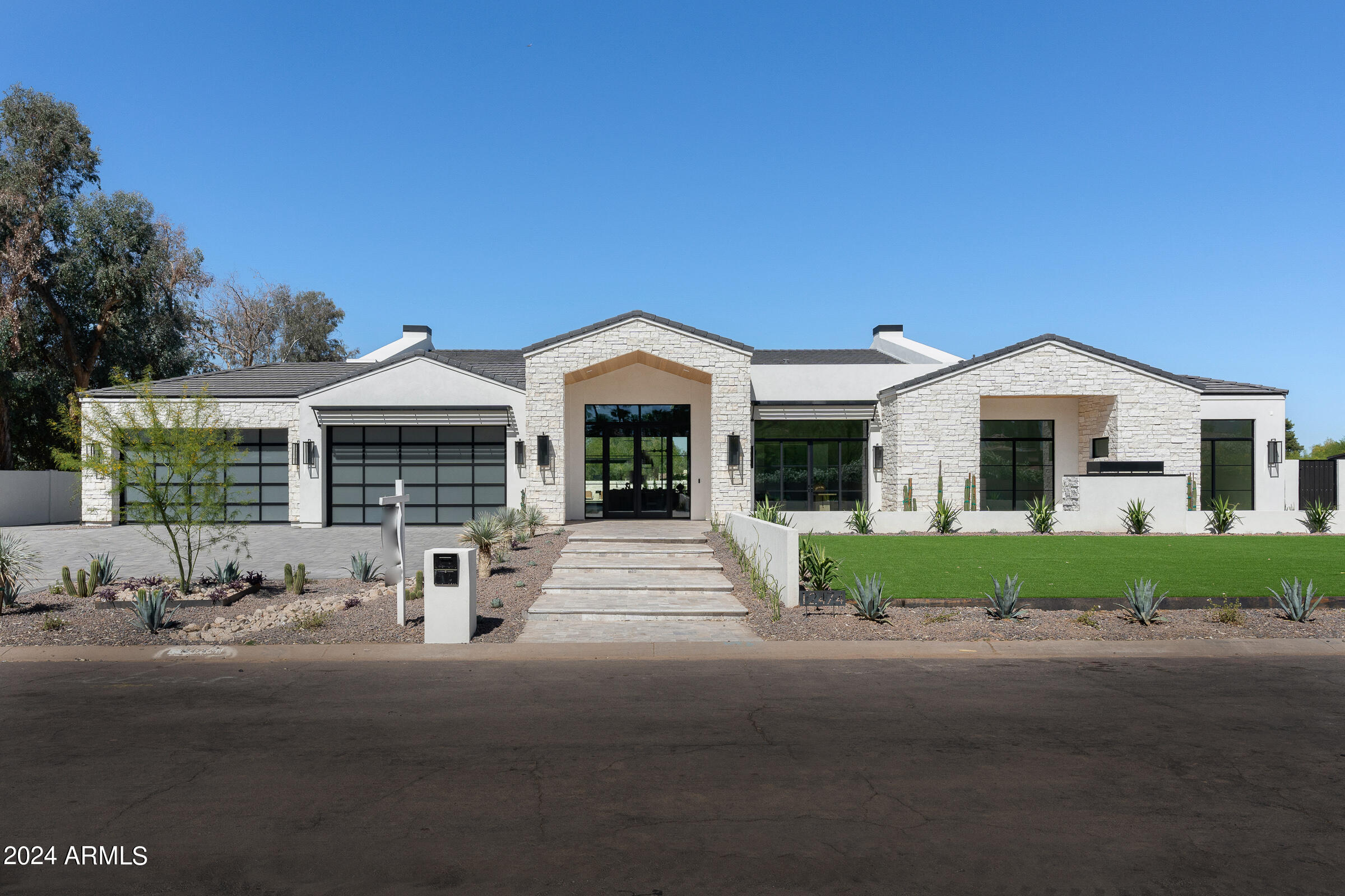 BEST PRICED NEW CONSTRUCTION IN ALL OF 85260/85259! Set on nearly an acre of beautifully landscaped grounds, this transitional home boasts 7,948 sqft of luxurious space inside and out. Featuring 5 elegant bedrooms, 6.5 baths, & a self-contained casita—perfect for guests, fitness room, or secluded private office. Ideal for both family life & large gatherings, the home includes a vast, open kitchen outfitted with exquisite porcelain, alongside a dedicated office & versatile media room for family activities & film enjoyment. The oversized four-car garage, with high ceilings suitable for lifts, is ideal for car enthusiasts. Outside, the resort-style backyard offers the ultimate retreat for relaxation & entertainment complete with a beautiful pool, spa, outdoor kitchen & pickle-ball court