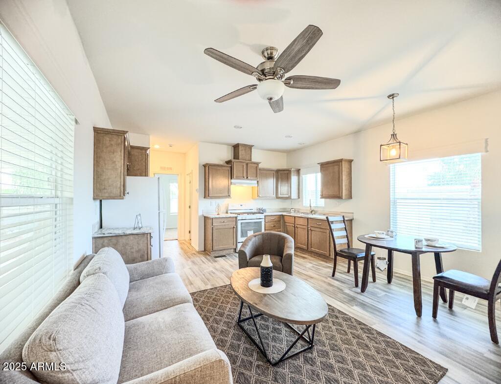 Experience ''like new'' living in this never-lived-in 2023 Cavco 2-bedroom, 2-bath manufactured home in the desirable 55+ Roadrunner Estates in Arizona City, AZ. Enjoy an open-concept layout with luxury vinyl floors, 9' flat ceilings, dual-pane low-E windows, & a split bedroom design for privacy. The kitchen offers a gas range, & refrigerator, while the primary suite features a step-in shower. Outdoors, find a high-profile carport, a matching storage shed, & low-maintenance landscaping. Located on a cul-de-sac with space between homes, residents enjoy a pool, & dog area. Land lease of $550/month covers water, sewer, trash, & common area maintenance. Ideal for retirees seeking affordable, low-maintenance Arizona living. Approval for residency required; furnishings negotiable.