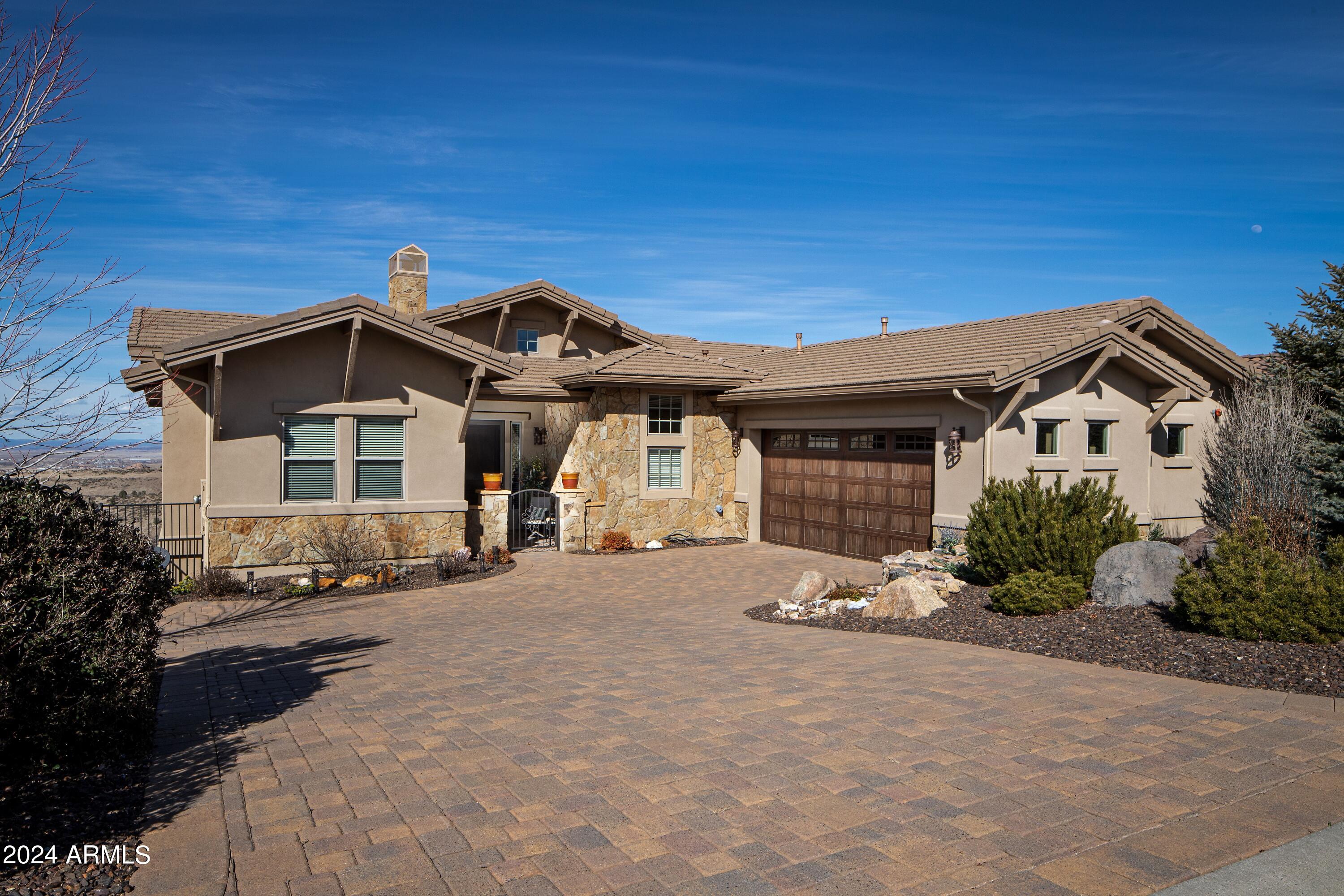 Million Dollar Views will be yours with this Custom Residence.  It is not often that a residence such as this one comes on the market.  The original owners who built the home have decided they would like to be closer to their family so it's your opportunity to get this one into Escrow before someone else.  Main Level Living with over 2300sf; Lower Level Living is 1090sf plus 881sf of finished Storage space too. This well thought plan creates functional easy living and maintenance.  Home has Fire Sprinkler System.  The bounty of windows brings the views into all of the main rooms.  The extensive covered Decks create the best outdoor entertaining/living space.  2.5 Car Garage with Built in Storage - Meticulously Maintained.  Entry patio is walled in with an iron gate (only ''fenced'' area)