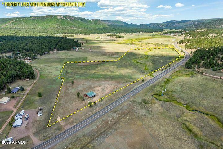 ****HUGE PRICE REDUCTION**** 45+ Acres of Scenic Land in Alpine, AZ - Panoramic Views, Privacy, and Endless Possibilities This
 stunning 45-acre property in the heart of Alpine offers unparalleled panoramic views of the surrounding mountains, valley, and the
 peaceful Luna Lake. With approximately 3,000 square feet of highway frontage along US HWY 180, this property is easily accessible
 and presents endless opportunities for development or leisure.