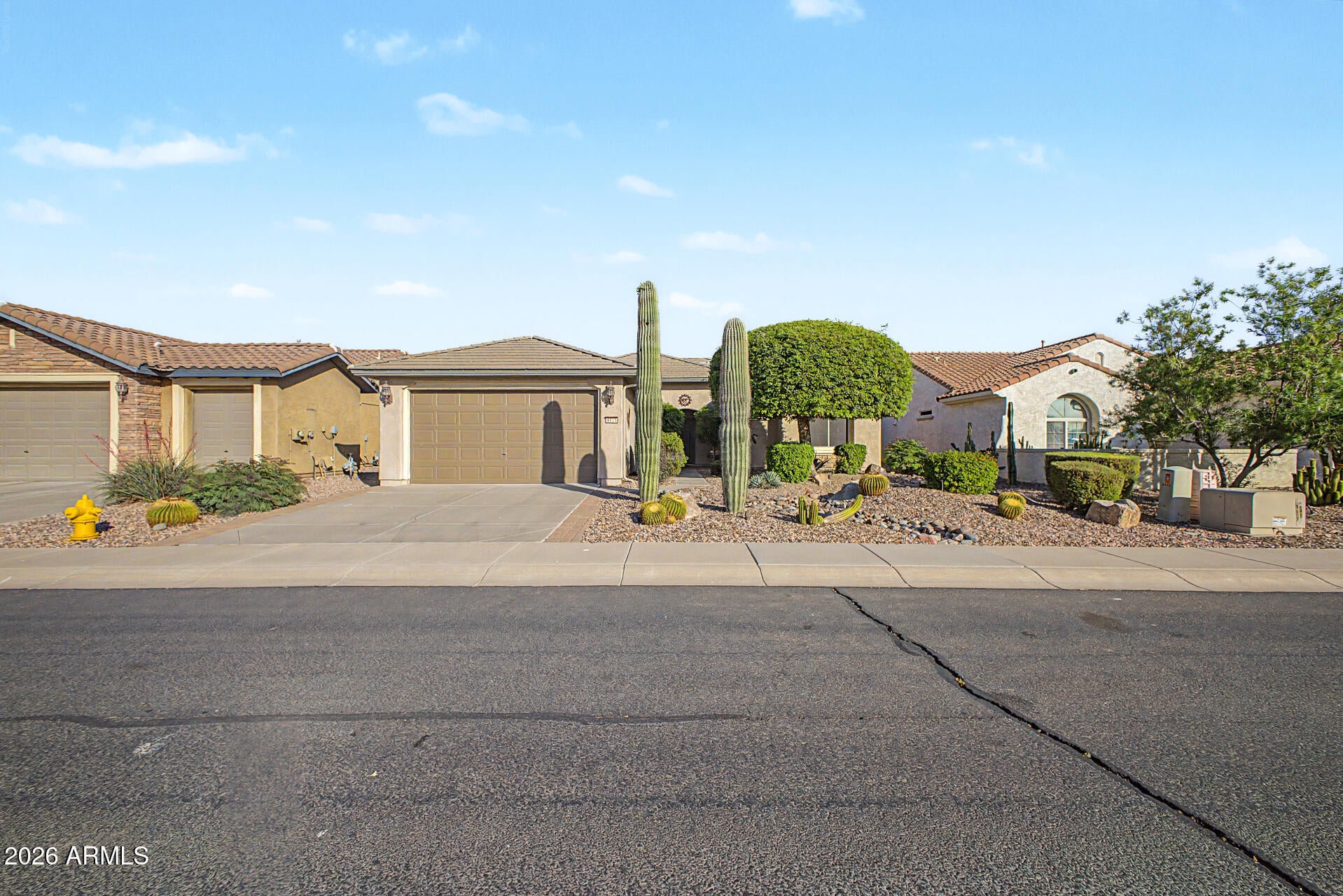 FULLY FURNISHED! HVAC new in 2023! Home, sweet home! This 2-bedroom, 2-bath residence in the adult Community of Anthem at Merrill Ranch showcases a 2-car garage and a lovely desert landscape. Discover a captivating open layout with high ceilings, a neutral palette, blinds, and durable tile flooring. The kitchen features a breakfast nook, ample wood cabinetry w/crown moulding, recessed lighting, SS appliances (new fridge and disposal), and a breakfast bar. You'll also find a cozy den w/murphy bed and built in desk. The primary bedroom boasts soft carpeting, a sitting nook, an ensuite with dual sinks, and a convenient walk-in closet. Imagine enchanting evenings in the charming backyard, complete with a covered patio, travertine pavers, and a built-in BBQ for weekend grills!