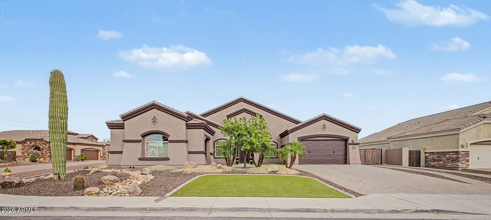 Proudly presenting this outstanding single-level masterpiece, where thoughtfully designed and standout features come together harmoniously. Starting with a 3-car garage, RV gate, and paver driveway. Inside, a harmonious blend of comfort and elegance will greet you, enhanced by wood-look tile flooring, plantation shutters, fresh paint, modern finishes, high ceilings, and archways. Bright living room invites you to unwind, while the captivating great room is the perfect spot for hosting lively gatherings. Stunning kitchen is a chef's dream, boasting recessed/pendant lighting, mosaic tile backsplash, a pantry, high-end stainless steel appliances, abundant cabinetry adorned with crown moulding, granite counters, and a prep island with a breakfast bar. Owner's retreat continues to impress! Plush carpet, a lovely bay window, an ensuite with a make-up desk, and a walk-in closet complete the picture. PLUS! The 2nd main bedroom w/its own walk-in closet and dedicated bathroom adds exceptional flexibility for guests or multigenerational living. Enjoy fantastic mountain views from the oversized backyard, showcasing a covered patio, storage shed, and sparkling pool with a rock waterfall. Live your best life in this exceptional home!