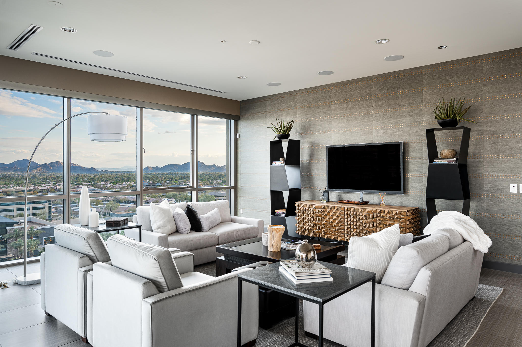 Rare opportunity to own the top level penthouse in the prestigious Plaza Lofts at Kierland * The best views in all of Scottsdale - Panoramic mountain views include the McDowell's, Camelback, and Mummy mountain ranges, amazing city lights, sunrise and sunsets * This open floor plan exudes luxury and elegance boasting floor to ceiling glass throughout and soaring 10ft ceilings * Telescoping doors in the great room and master lead to dual South facing balconies * Enormous master suite with private balcony, sitting room, spa-like bath, and walk-in closet * Amenities include concierge, fitness studio, lounge, heated pool, grilling stations, pet park, and VIP discounts on shopping and dining throughout Kierland Commons, Scottsdale Quarter, and Westin Kierland Spa and Golf Club *