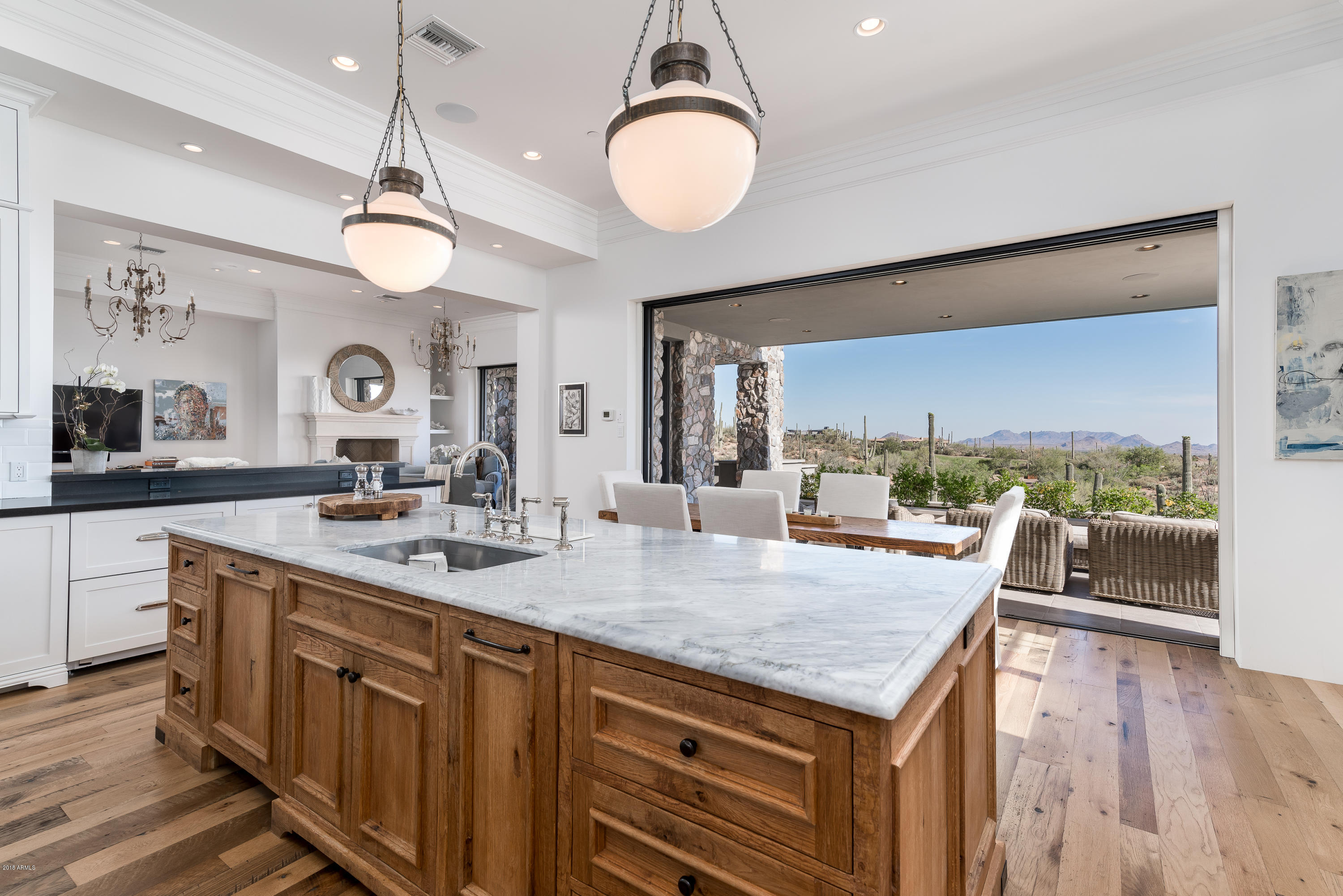 Newport Beach meets the High Sonoran Desert with a One-of-a-kind Contemporary Estate on 2 acres located high above the Valley of the Sun in the exclusive community of Desert Mountain in North Scottsdale, AZ.  City Lights, Sunsets, and Golf Course views from an elevated serene and private location. Light bright interior with telescoping doors to welcome the rich Sonoran desert into the exceptional living environment with exquisite use of natural stones from around the world. Perfection of an open floor plan provides ease of livability, functionality, and space for every endeavor. Two room master suite, award winning closet, private office, media room, game room, lap pool, spa, two fire pits, extensive patios, elevator, 4 car garage, everything for the most discriminating buyer.