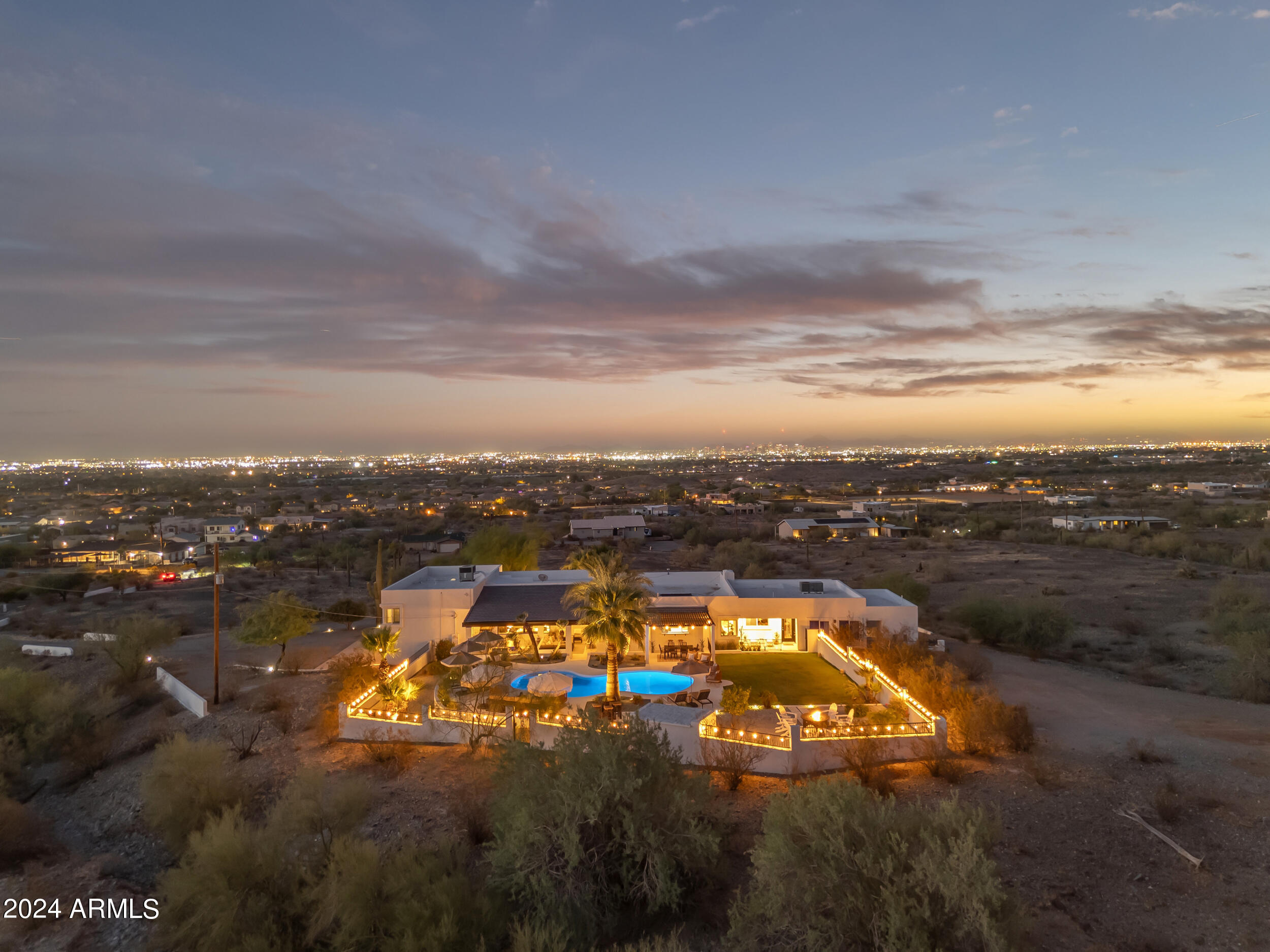 Escape the hustle and bustle of the city. Nestled on over 3+ acres across 2 parcels, this 5-bed, 5 bath estate backs up to the Phoenix Preserve, w/ direct access to South Mountain's hiking trails from your backyard. Appraised May 2026 $1,784M. Panoramic 360-degree mountain views, enjoy peace and tranquility as you gaze out over the city in this serene desert retreat. This home is an entertainer's dream, w/ sparkling pool, built-in BBQ, and an expansive backyard designed for hosting family and friends. Step inside to find a beautifully updated interior with a chef's dream of a kitchen. Adding to its appeal, the property has a separate 1-bed, 1-bath suite with its own kitchen, living room, and views. Experience resort-style living & everything Phoenix has to offer! $300K+ upgrades! This exceptional estate spans two separate parcels totaling 137,004 sq ft (3.14 acres), providing ample space for outdoor activities and privacy. With individual parcel sizes of 81,108 sq ft, 55,896 sq ft, there's plenty of room for your imagination. The guest attached guest suite is 622.5 sq ft of the total 4,034 sq ft. There are 1,261 sq ft of outdoor covered living area.

The expansive lot allows for parking toys, housing horses, or creating customized landscaping. The interior boasts newer flooring and fresh paint throughout, enhancing the home's appeal.

This property truly offers a unique combination of tranquility and convenience, all while being just minutes from the vibrant offerings of Phoenix!