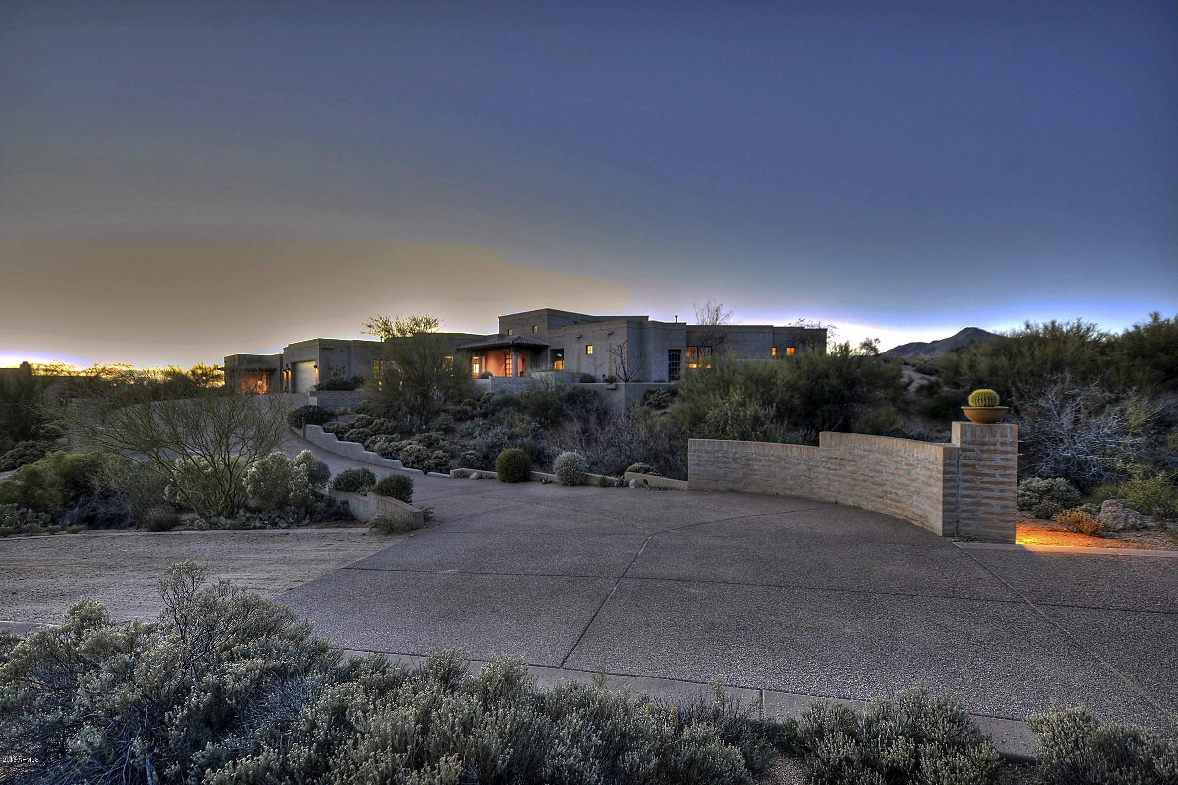 Authentic Adobe Jewel with Casita - Elevated setting provides panoramic, sunset vistas. Charming interiors reflect authentic Southwest architectural features and quality craftsmanship found in the custom woods doors, cabinets and finishes  and stone work throughout. An inviting great room features a beautiful hearth, white-washed beamed ceilings and gorgeous views. A spacious 920 SF casita addition features a large living room, kitchenette and private en suite bedroom. Golf or Lifestyle Membership available by application to the Desert Mountain Club featuring 6 Nicklaus golf courses, 6 restaurants/club houses, Flick golf learning center, fabulous new spa/fitness center, equestrian center and 16+ miles of private hiking trails in the Tonto National Forest!