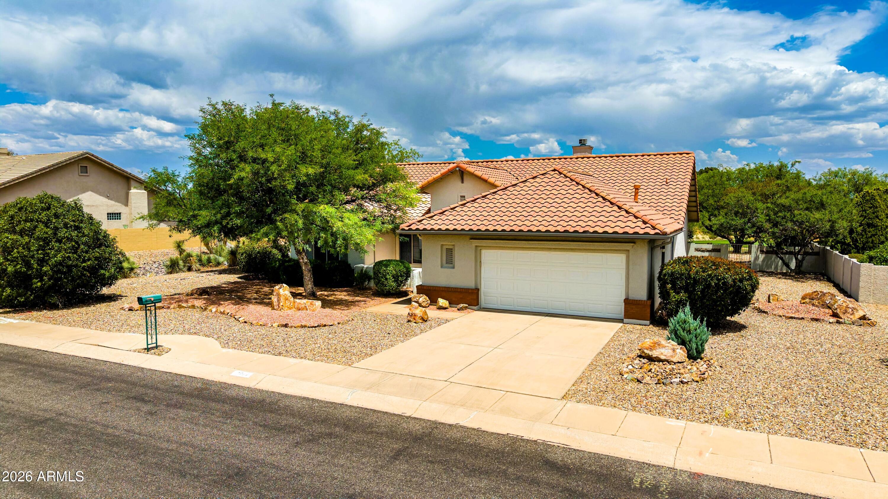 This is the one! Come see this lovely Sedona model in the desirable 55+ gated community of Winterhaven, offering a split floorplan with 2 bedrooms, 2 baths, and a versatile study/den. A beautiful built-in bookcase separates the living room from the spacious kitchen & dining room, creating a uniquely defined layout. There is new flooring throughout most of the home, Anderson windows with newer treatments, fresh interior & exterior paint, and a newly upgraded roof. The living room features a stunning fireplace with Turkish tile, and the large primary suite includes a remodeled ensuite bath and walk-in closets. Relax in the fully enclosed patio or on the welcoming back terrace overlooking one of Winterhaven's largest yards- complete with fruit trees, flowering bushes, and a view of the golf
