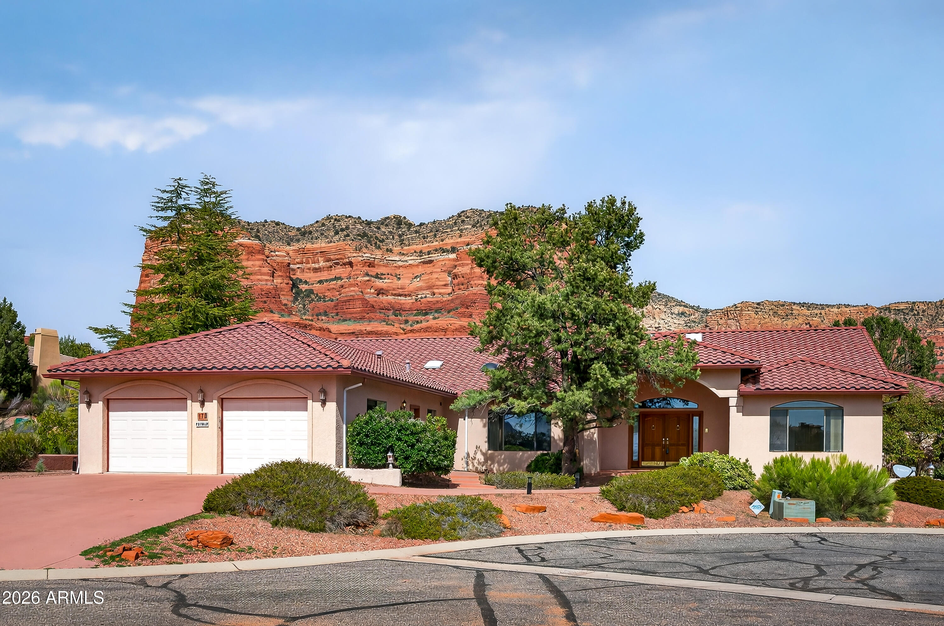 Stunning Sedona home with iconic Red Rock views -- spacious 3-bedroom residence thoughtfully updated for modern living. Recent improvements include new kitchen appliances, new flooring, upgraded ceiling light fixtures and fans, and fresh interior paint. Located in a desirable, high-end neighborhood with easy access to shopping, premier hiking and biking trails, and top-rated golf.  A move-in-ready retreat blending mountain beauty with contemporary comfort. This is an oversized lot as it was two lots combined into one measuring 
0.69 acre.