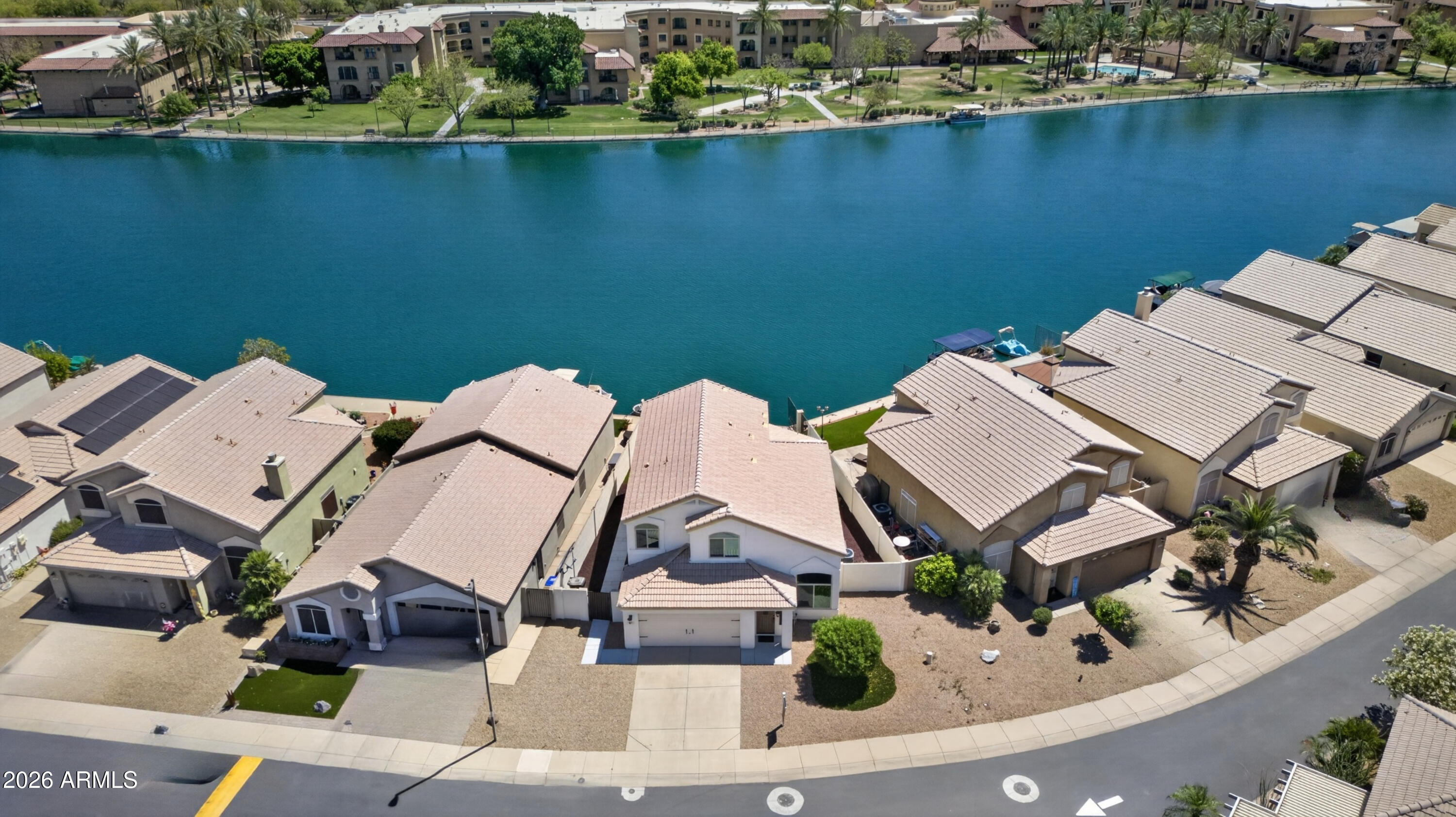 Rare Waterfront Luxury in Harbor Island

Experience the ultimate lifestyle in this stunning 3BR/3BA residence, featuring a comprehensive 2025 full remodel. Situated on a premium lakefront lot in Harbor Island, this home blends modern sophistication with panoramic mountain and water views.

Inside, find soaring vaulted ceilings and brand-new 2025 flooring. The chef-inspired kitchen boasts new quartz countertops and a custom island. The primary retreat offers a spa-like ensuite with a separate tub and shower.

The backyard is a true oasis with high-end synthetic grass leading to the water's edge. Bonus: 3-car garage with cabinets and gated community amenities including a heated pool and spa. Move-in ready with zero deferred maintenance--