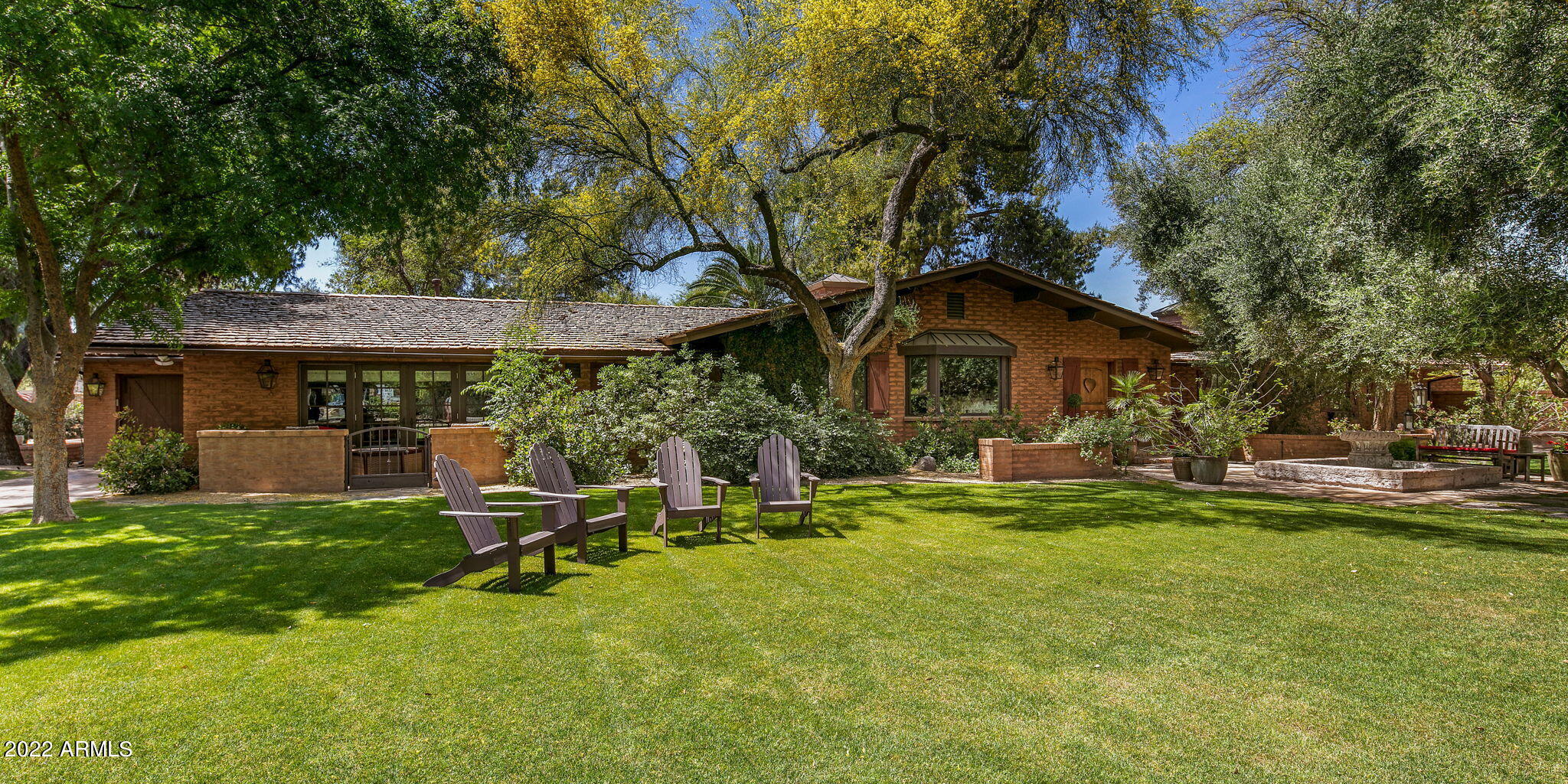 Quintessential Paradise Valley Farms home, situated on a 1.32-acre corner lot. Taken down to the studs in 2004 with a full renovation & addition by the renowned team at Candelaria Design Group. 
Light and bright with timeless details including vaulted tongue and groove ceilings, hickory hardwood floors and exposed brick walls. 
All four bedrooms are en suite, including a guest room with a separate entrance. 
Generous detached 3-car garage with drive-through option, high garage door entry and a one car-lift to accommodate a 4th car. In addition, a 1-car attached garage, for 7 potential car w/ 2 more lifts.
1,200 SF four stall barn with water and electric run to it. Could be a great value add conversion into a guest house, home office or workout area. Horses are welcomed in PV Farms! Covered gazebo with fireplace in the backyard. $100,000 new cedar shake roof in 2021. No HOA. Rare opportunity to live in one of the most desired locations in the valley, Paradise Valley Farms.