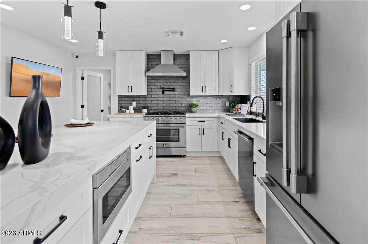 Some homes you walk through. This one you feel.

From the moment you step inside, it's clear every detail was intentional. Smooth wall finishes, elevated materials, and a level of craftsmanship that quietly separates it from anything else in the area. And the location backs it up. You're minutes from the brand new Lifetime Fitness, the PV Mall redevelopment, and tucked into one of the most sought-after school pockets in the city, public, private, or charter.

The kitchen is the heartbeat. A bold waterfall-edge island anchors the space, paired with a professional-grade 6-burner gas range, pot filler, and a walk-in pantry that handles real life, laundry and all. A premium Samsung washer and dryer set on pedestals stays with the home. The primary suite is private, calm, and intentional. The bathroom feels like a boutique hotel. The custom walk-in closet is built for how you actually live, not just for show.

Step outside and it gets better. With east/west exposure and the front facing west, the backyard stays shaded through Arizona's hottest hours. Sitting on an oversized 9,000+ sqft lot, the yard delivers premium Forever Green turf backed by a 30-year warranty, a dedicated garden, a chicken coop that adds personality without sacrificing function, and a built-in doggy door for easy in and out. The pebble play pool features a variable speed pump for lower energy costs and a custom safety cover with locking storage roller, dialing in luxury and practicality.

The fundamentals match the finishes. No HOA. 2023 roof. Owned and warrantied Parker & Sons water softener and treatment system. A full Ring security setup with doorbell and cameras. In-wall speakers, dimmers throughout, and Cox fiber internet. A floor plan that actually makes sense.

Over $55,000 in thoughtful upgrades since 2023, and it shows.
Grab dinner at 32 Shea, hop on the 51, and ride the long-term upside this neighborhood is quietly building.

This is the kind of home that checks the boxes you can see, and the ones you don't realize matter until you're living in it.

Come see it in person. It hits different.