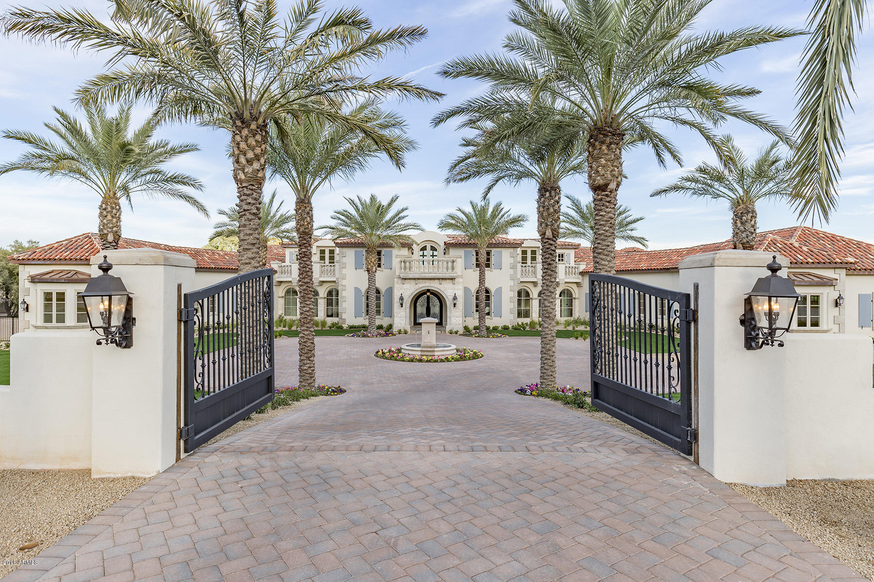 The most exquisite home in Paradise Valley on beautiful Wilkinson Rd. New construction on 2.24 acres features  15,000 sq ft of living and entertaining spaces designed by Shane Ames. The design style is Palm Beach Transitional and features light and current finishes such as Rio Lago honed marble flooring and a variety of creamy honed marble surfaces.  Furniture grade cabinetry by Burdette and gorgeous wood framed windows by Jeldwen; groin vaulted ceilings and custom wood moldings in every room.  Six spacious en-suite bedrooms; the master featuring a serenity room and opulent his/hers baths.  Fabulous open kitchen with the best of the best appliances.  Family room opens to outdoor living room with fireplace and kitchen. Wood paneled office, theatre/game room.  Gorgeous pool and patios.