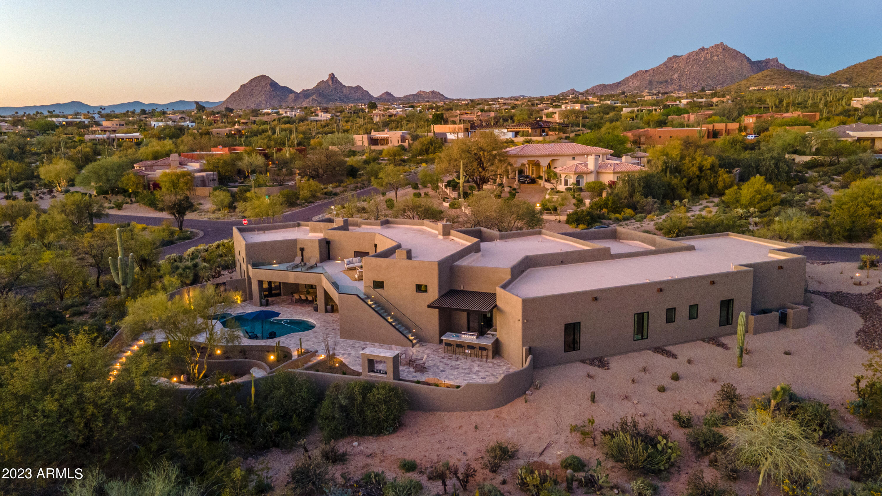 Voted ''Best of Tour'' by Pinnacle Peak Luxury Home Tour.  North Scottsdale Luxury Rebuild! Stunning 5 bedrooms, 6 bathrooms and 5 car garage. This dream home is extensively rebuilt with new roof, spa, pool, septic, all new HVAC, plumbing, electric, windows, etc. Luxury interior design with state of the art appliances, custom cabinetry including a hidden walk-in pantry, millwork, lighting and tile details. The ''family suite/laundry room'' features double washer/dryers, built in desk and custom dog wash.  Entertainers dream backyard with aluminum pergola over outdoor kitchen , putting green, mature saguaros, fire pit with built in seating and walk deck with glass railings, mountain and city light views in every direction. This house has it all and offers flexibility for every family. Seller is motivated so bring an offer!!!