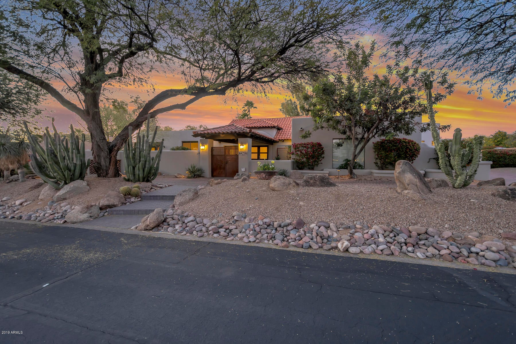 Overlooking 3 fairways of the Pinnacle Peak Country Club this home offers phenomenal golf course and sunset views. Completely gutted and renovated in 2014 with many more improvements made since then. Open great room floor plan with 2 masters, an additional bedroom, an office & 3.5 baths in the main house. Newer Quartz counter tops in the kitchen & marble counter tops in the baths. The renovated separate guest house has another bedroom and full bath & the same spectacular views. With a 4 car garage and tall ceilings throughout this home is truly one you won't want to miss!