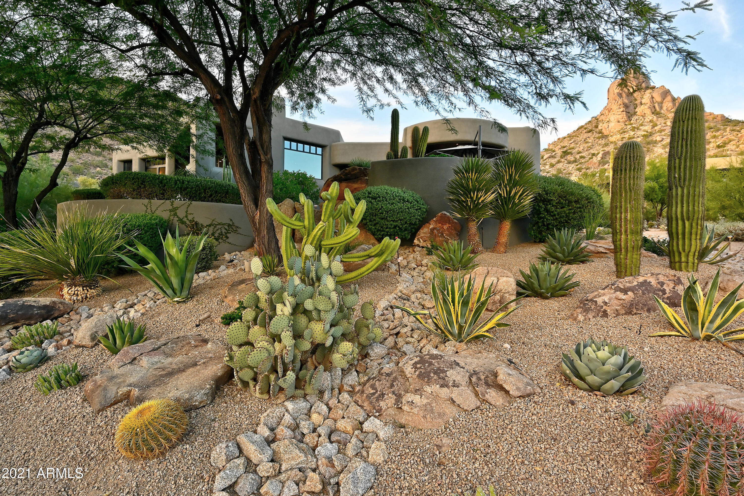 Rare Opportunity!  Spectacular custom home nestled in the Hillside Villas enclave of Desert Highlands.  Blending seamlessly with the topography & surrounded by natural open space, boulder outcroppings & the majesty of Pinnacle Peak. 
Melting interior space into exterior through 4 sets of telescoping doors, thoughtfully placed, each framing a stunning visual picture of the sparkling city lights, a spectacular sunrise or the purple sky at sunset. Re-mastered in 2020, the new design has successfully integrated the art of entertaining with the ease of livability. Exquisite custom finishes & unique design elements throughout, promising no detail left unaddressed. Desert Highlands invites you to enjoy the World Class amenities & a lifestyle that offers an unparalleled country club experience. $95,000 fee to Desert Highlands to be paid by buyer at close of escrow.  Furnishings available under separate bill of sale.