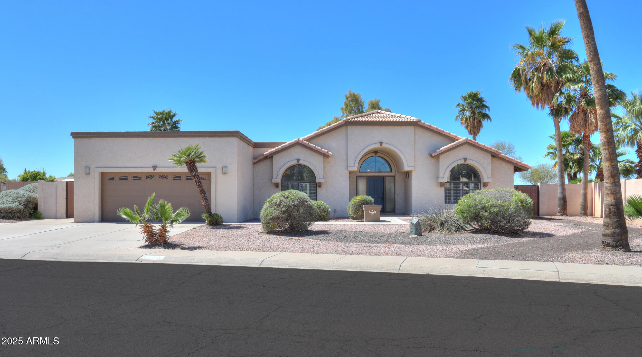 This is your opportunity to live in Casa Grande's only community offering both golf course lots and lakefront living. This stunning 4
bedroom home overlooks the 4th tee at Dave White Golf Course. Stunning ceiling height stacked stone fireplace in the living room is the
first thing you see as you enter the home, plus formal dining and family room. Kitchen includes a breakfast area, maple cabinets, granite counters, and travertine backsplash. Large master bedroom has a private door to the patio, master
bath includes jetted tub and oversized shower. Two large bedrooms are at the end of the hall, with a 4th bedroom/den near the entry. This house has LOADS of storage throughout! Landscaped backyard features a fenced Pebbletec pool and large grass area and huge covered patio for entertaining Plantation shutters throughout. Home was recently repainted inside & out and re-carpeted to sell and has been well maintained. Both AC units have been replaced. Community features private clubhouse and lake access to HOA members