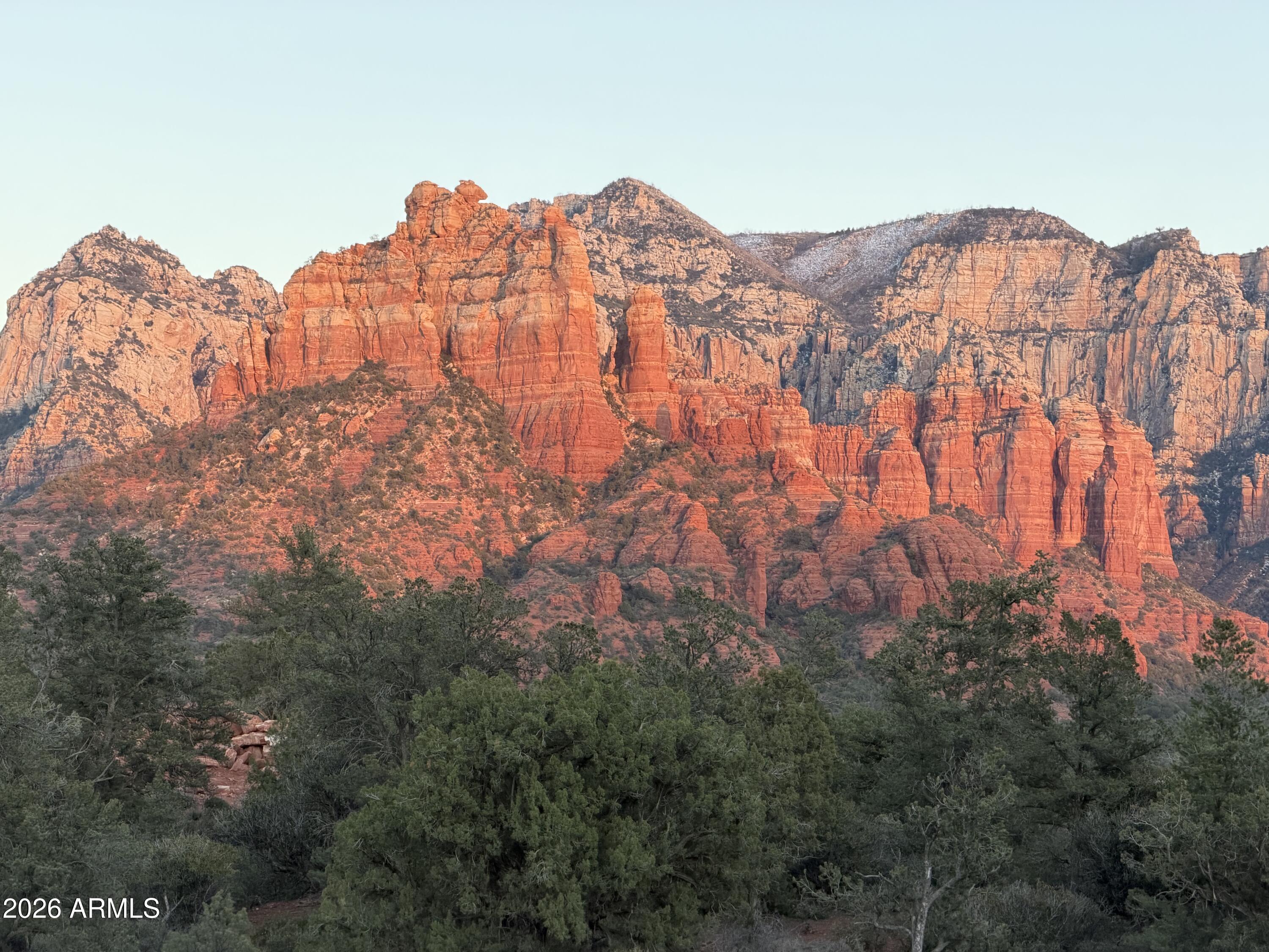 Builders & Developers! Turnkey, shovel-ready to build Heart of Sedona residence club project. 10 platted, separately parceled lots EXCLUSIVE BUILDER AND PROPERTY MANAGER RIGHTS ON ALL 19 LOTS AND CF 1.7 AC CCRC PARCEL.  9  approximately half-acre+ short-term rental luxury wellness residence club community lots PLUS rare adjoining 1.7 acre commercial lot, the only undeveloped commercial lot in new town square across from new town square park and historic ranger station Cf zoned for clubhouse, med-spa, assisted living(80-100 units), wedding, corporate facility, etc.(see document tab chart of allowable uses). The 9 best lots in Sky Ridge Estates, with road and all underground utilities, are estimated to be completed in late 2026. Located in the HEART OF SEDONA, WALK TO NEW TOWN SQUARE FINE DINING & SHOPPING AND OAK CREEK. RIDGE TOP QUIET PANORAMIC VIEW LOTS.
       The residence club is like a resort, but instead of renting a room, one has an entire home with resort amenities. The 1.7-acre CF-zoned commercial lot is the only undeveloped lot in the New Town Square/CCRC continuing care retirement community, with possibly 90 units. 10 years in the making, improved, entitled, ready to build lots, all zoning in place, PLUS EXCLUSIVE BUILDER RIGHTS TO BUILD ALL 20 custom homes for existing lot owners, plus EXCLUSIVE SHORT-TERM RENTAL/ MANAGEMENT RIGHTS - residual management fee income. Seller is a high-end custom home builder, broker, and developer, and can build out for you and manage rentals. 
Rental Comps: 
1.).5 mile away, Ambiente, La Auberge, and 10 minutes away Enchantment resort; first two with road noise below the highway, renting for up to 2200+ per night (for 550 s ft) with 75% occupancy. Sky Ridge will be quieter, with much better views and location, and much higher-end homes, 2500-4500 s ft 3/3 AND 5/6 BED BATH, fetching MUCH more. This is a one-of-a-kind project. Seller will begin construction late 2026. The seller has many projects and is looking to consolidate and semi-retire. Several other large land listings of similar size in the area are for sale, but will take 10 years to get approvals/permits/utilities,  are raw, unimproved(took 10 years to get Sky Ridge done), and millions in improvements with costs sky rocketing.
Most recently sold lot comp lots in residence clubs);
1.)60 Indian head lane .54 acre lot 1/15/2024 sold for 1,250,000.
2.)170 HIDDEN MEADOW DR 7, 1.3-acre lot 3/26/2025 sold for   3,100,000
3.)75 PASEO DEL INEZ 7; 81-acre lot 1/13/2026 sold for 1,350,000.

*gates and assisted living not approved, but within allowable uses within zoning as of 1/1/2026, projects within zoning and building code can go straight to application for permit, skipping the years-long brain damage, deal fatigue of fighting city counsel and Planning and zoning.
The last of the large land parcels can take 5-10 years to be ready for construction. This project took 9 years!
