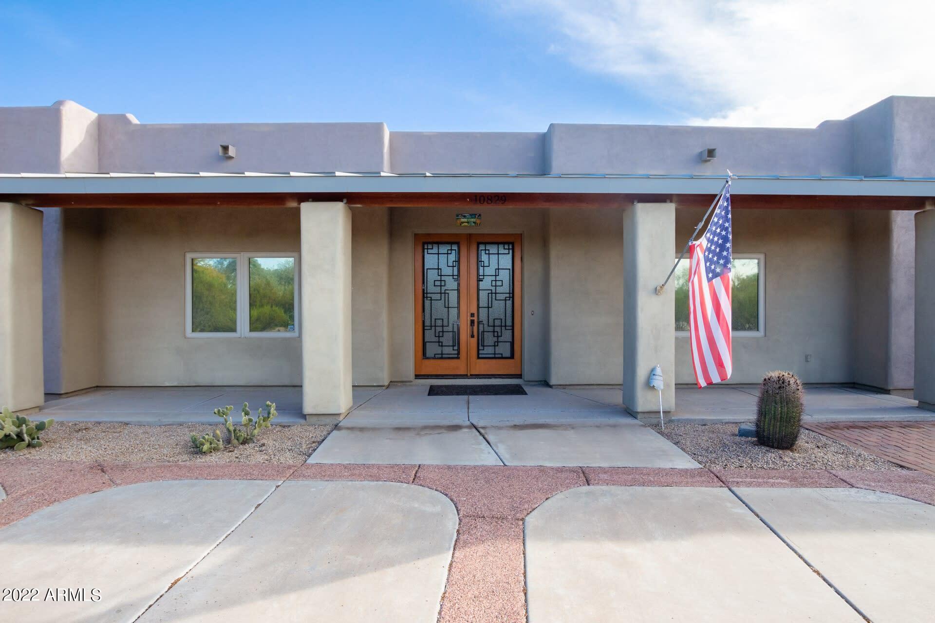 Mountain views, lots of space and beautiful single story, 3828 SF home in Sundown Ranch Acres, Scottsdale! 4 bedrooms, 4 baths (1/2 bath outside), office & bonus/theater room. Spacious master suite with oversized shower spa & natural gas fireplace. Pool, gas fire pit, sport court, putting area for outside enjoyment. 
1 car garage with built in cabinets, elevated door & ceiling. Two car garage with built in cabinets & extra storage space.16' RV Gate. 8.5 kW SOLAR FULLY PAID FOR