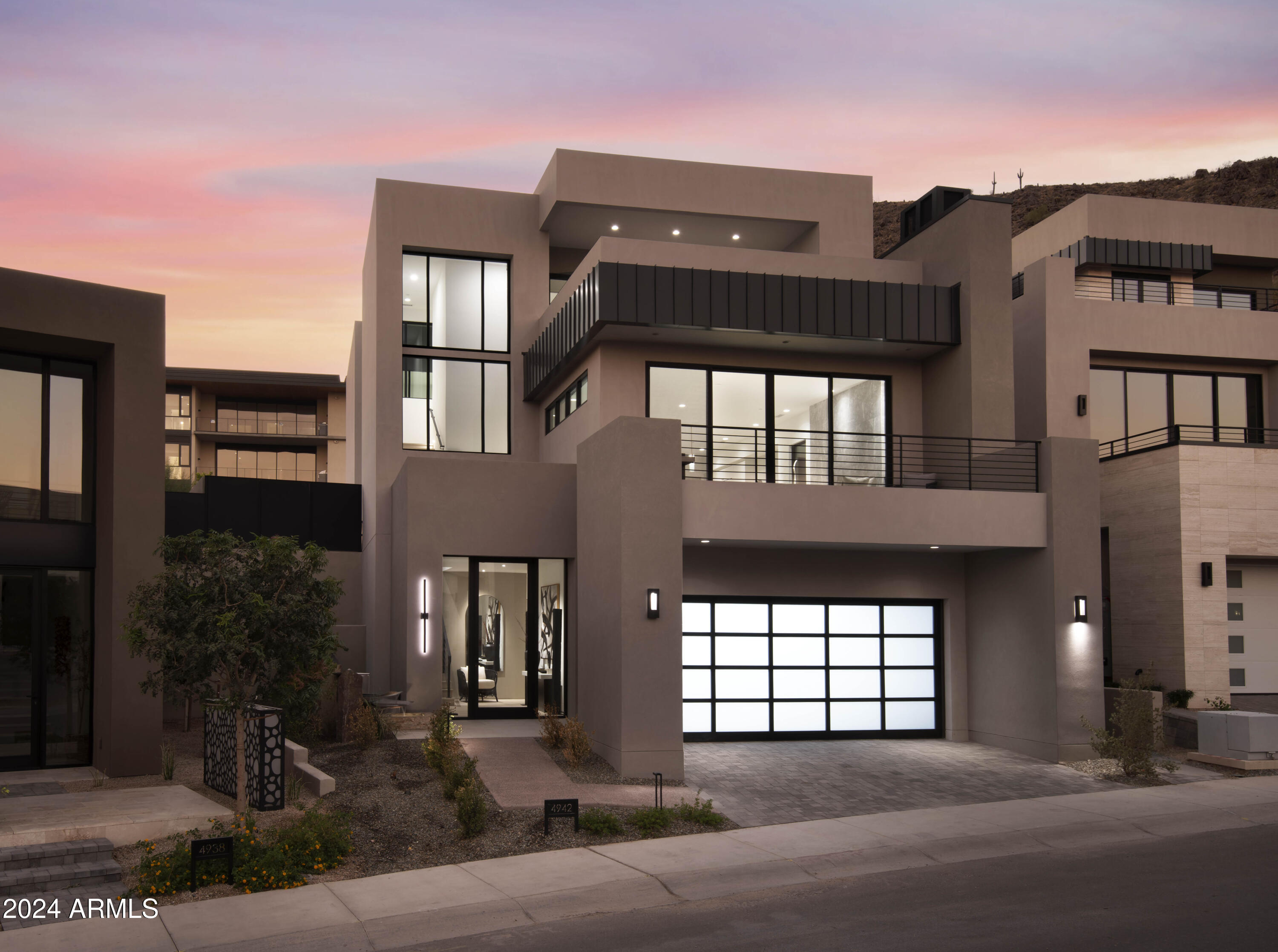 FULLY FURNISHED AND TURN-KEY READY! HARMONY LUXE RETREAT LOCATED IN THE ASCENT AT THE PHOENICIAN - THE ESTATES. NEW HOME CONSTRUCTION BUILT BY CULLUM HOMES. THIS THREE-LEVEL HOME FEATURES 3 BEDROOMS, 3.5 BATHROOMS, A PRIVATE OFFICE AND A 3-CAR GARAGE. THROUGH THE EXTRAVAGANT FRONT ENTRANCE LOCATED ON THE LOWER LEVEL, A BEAUTIFUL STAIRCASE OR AN ELEVATOR TAKE YOU TO EVERY LEVEL OF THE RESIDENCE. THE MAIN LEVEL BOASTS TWO EN SUITE BEDROOMS, PRIVATE OFFICE, FORMAL DINING AREA, BUTLER'S PANTRY, OPEN CONCEPT KITCHEN, ADDITIONAL POWDER ROOM AND THE GREAT ROOM AREA. SPACIOUS KITCHEN WITH ISLAND, EAT-AT BAR AND WALK-IN PANTRY. A GLASS WALL LEADS YOU TO THE COVERED PATIO OFF THE GREAT ROOM WHERE GORGEOUS VIEWS AWAIT YOU. OWNER'S SUITE WITH WALK-IN CLOSET, DOUBLE SINK VANITY, SEPARATE TOILET
ROOM TUB AND WALK-IN SHOWER SIT ON THE TOP LEVEL. ALONG WITH A LARGE LAUNDRY ROOM WITH EXTRA STORAGE, PRIVATE OFFICE SPACE AND TWO DECKS. THE COMMUNITY IS GUARD GATED FOR PRIVACY AND SECURITY. AT THE BASE OF CAMELBACK MOUNTAIN, YOUR PRIVATE POOL, FITNESS CENTER, AND SOCIAL SPACES OFFER AN INTIMATE GATHERING PLACE FOR WELLNESS, SOCIALIZING AND RELAXATION. RESIDENTS ARE OFFERED THE OPTION TO JOIN THE PHOENICIAN® AMENITY ACCESS PROGRAM ACCESS AND DISCOUNTS TO THE NEW ATHLETIC CLUB, 38,000 SQUARE FOOT SPA, TENNIS FACILITY AND RESORT POOLS AT THE PHOENICIAN® RESORT.