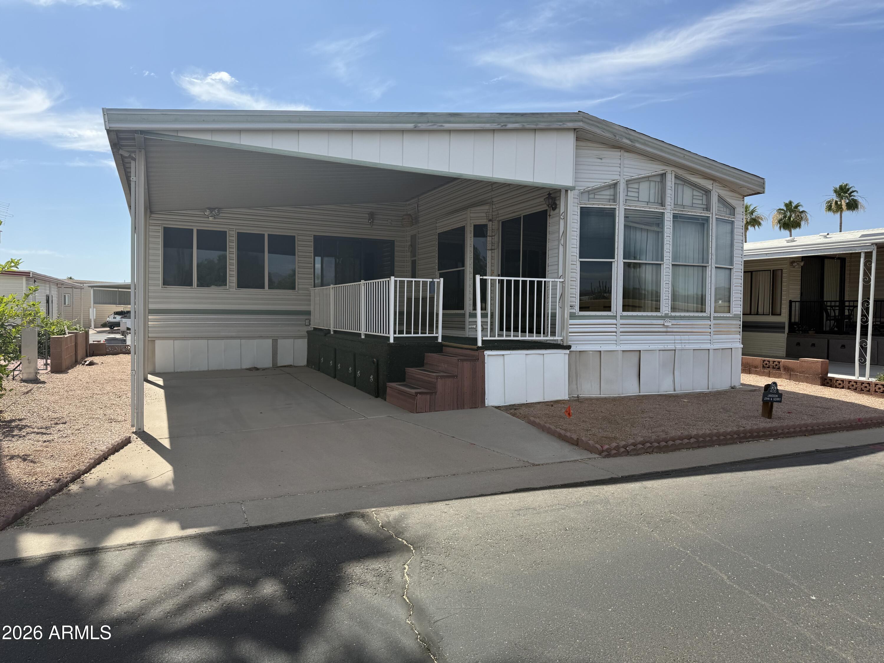 This east facing home is in a prime location in Carriage Manor Resort, a premier 55+ Community where you OWN THE LAND! Priced to remove and put on a new Park Model or Manufactured Home. Or if you're looking for something that just needs a little TLC, you've found the right home.  Carriage Manor has 24/7 on site security, a heated SALTWATER pool/spa, fitness facility, Tennis, Pickleball, Bocce, Shuffleboard, Golf Club, Billiards, Lapidary/Silversmith, Ceramics, Glass Art, Sewing, Wood shop, Bingo, Dances parties & many more activities & amenities