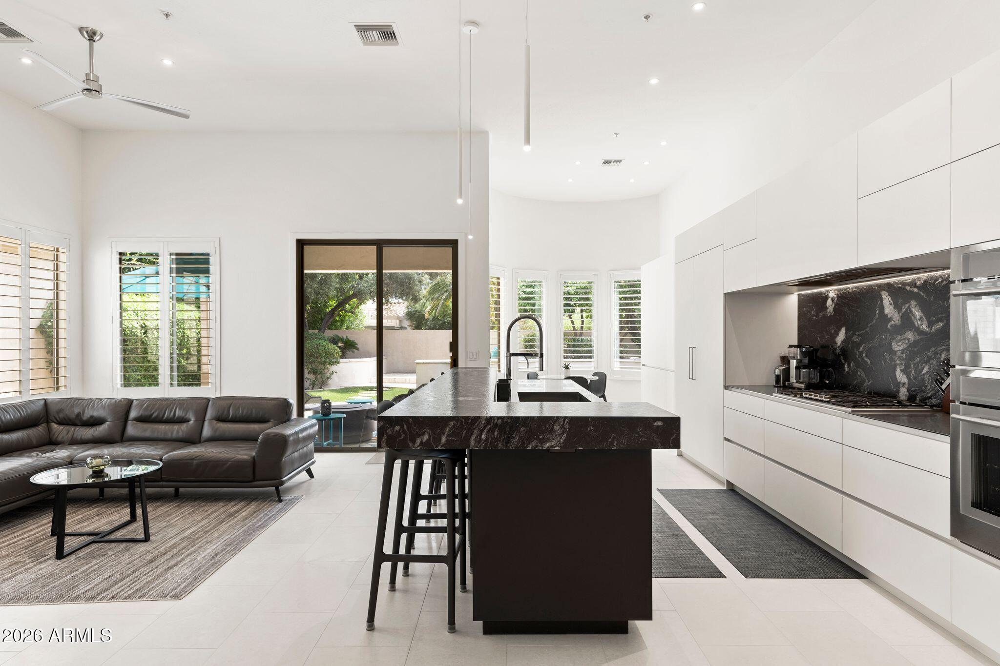 Experience luxury living in the highly sought-after guard-gated Gainey Village
community. This immaculate and stunning single-level home has been beautifully remodeled,
showcasing an open-concept layout, designer finishes, and elevated details
throughout. The expansive primary suite features a spa-inspired bathroom
and generous walk-in closet. Enjoy an unbeatable location, just minutes from
Scottsdale's top shopping, dining, and golf.
