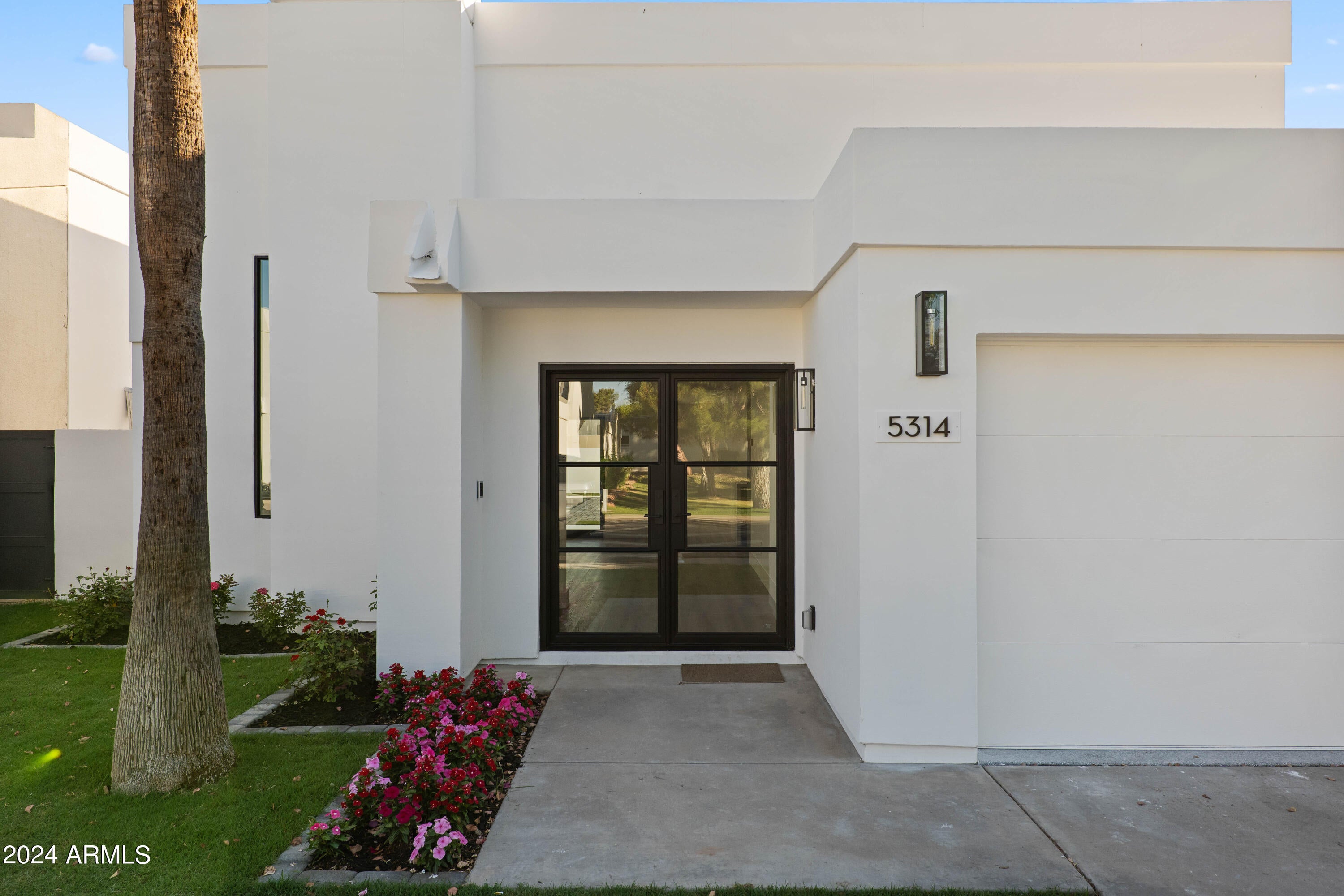 This exquisite home is located in the highly sought-after Colony Biltmore neighborhood in Phoenix. With its 24/7 guard-gated security, this neighborhood offers a luxurious and secure lifestyle. The stunning house has undergone a complete and meticulous renovation, using high-quality finishes and fixtures to showcase a perfect blend of modern and classic design.
Boasting three bedrooms, two full bathrooms, and an expansive 2,100 square feet of open-concept living space, this home is filled with an abundance of natural light and 17-foot ceilings. The spacious kitchen is fully equipped with top-of-the-line GE Cafe appliances, custom cabinetry, a large walk-in pantry,  induction cooktop, a wine fridge, and an oversized beautiful island with counter-height seating, making it perfect for This exquisite home is located in the highly sought-after Colony Biltmore neighborhood in Phoenix. With its 24/7 guard-gated security, this neighborhood offers a luxurious and secure lifestyle. The stunning house has undergone a complete and meticulous renovation, using high-quality finishes and fixtures to showcase a perfect blend of modern and classic design.

Boasting three bedrooms, two full bathrooms, and an expansive 2,100 square feet of open-concept living space, this home is filled with an abundance of natural light and 17-foot ceilings. The spacious kitchen is fully equipped with top-of-the-line Monogram appliances, custom cabinetry, a large walk-in pantry,  induction cooktop, a wine fridge, and a beautiful waterfall island with counter-height seating, making it perfect for hosting guests.

Each of the bedrooms features western sliding doors that open up to a picturesque backyard, complete with a beautifully manicured lawn, a sparkling pool, and a relaxing jacuzzi. This ensures complete privacy and an ideal indoor/outdoor living experience.

The primary suite is especially impressive, featuring western sliding doors leading to the backyard oasis. The bathroom is spacious and beautifully designed, boasting an oversized walk-in shower, dual floating vanities, custom cabinetry, LED mirrors, and a stunning walk-in closet designed and installed by California Closets.