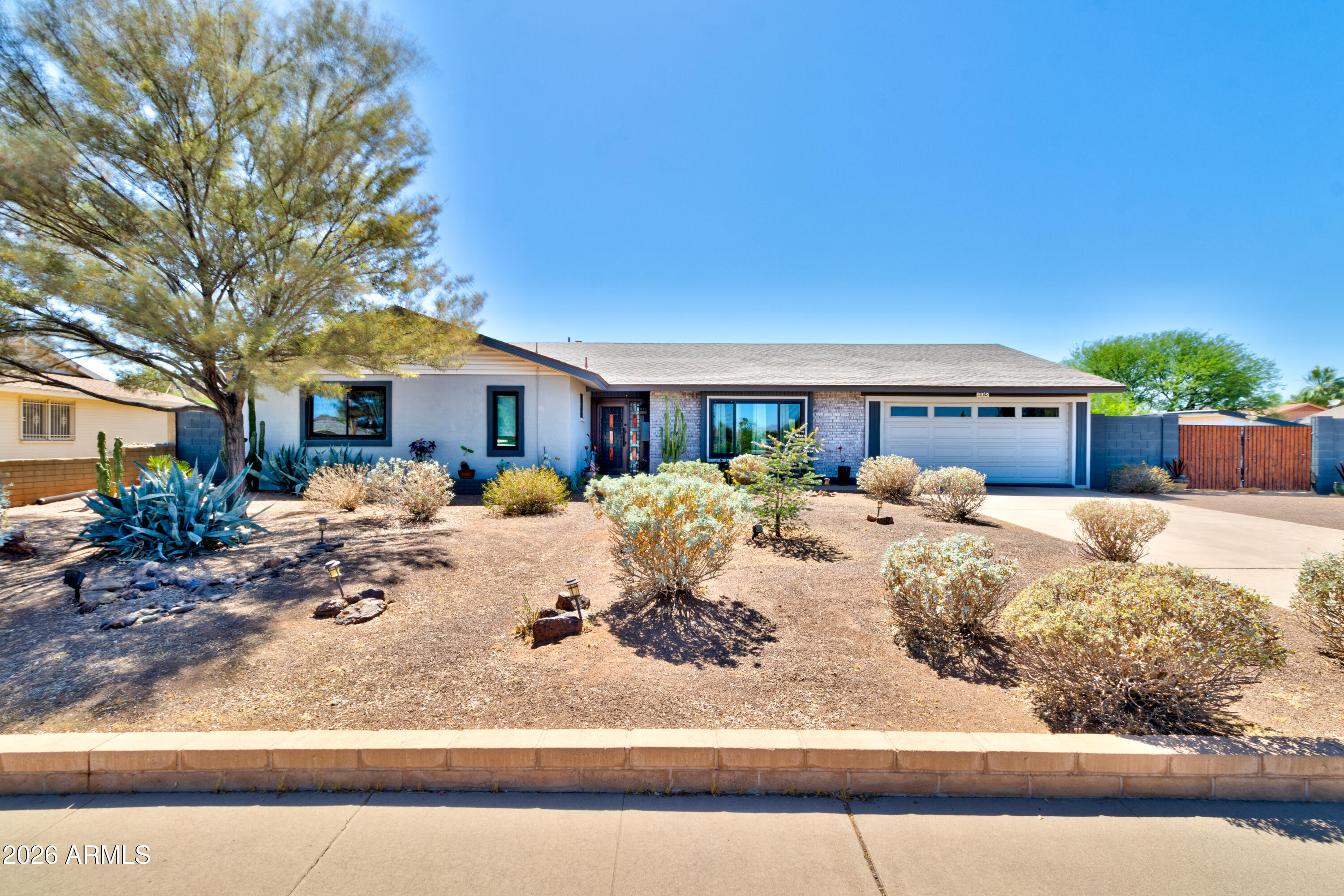 Welcome to this beautifully maintained home in the highly desirable Paradise Valley Oasis community, where quiet streets and stunning mountain views create the perfect backdrop for everyday living.  
Offering a large corner lot with over 2,000 square feet of thoughtfully designed space, this 4-bedroom, 2-bath home provides both comfort and flexibility, ideal for families, remote work, or entertaining guests.
Step outside to an easy-care backyard designed for low maintenance living, complete with a custom-built, insulated studio. Perfect for creative art space, a home office or gym. Refrigerator, washer dryer and firepit chairs all convey with the sale. NO SHOWINGS UNTIL MAY 16TH.
Inside and out, the home has been tastefully updated, blending modern touches with lasting quality.
Energy efficiency is a bonus with a leased solar system featuring low monthly payments, helping to keep utility costs manageable.
Be sure to review the full list of upgrades and features in the documents, this home has even more to offer than meets the eye.  There is a solar lease, and agreement can be shared upon request.