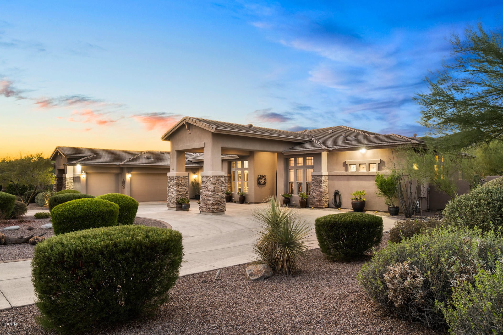 This elegant custom home with a circular driveway and 3 car garage sits on a 3/4 acre lot on a quiet cul de sac with amazing views of the McDowell Mountains in a private gated community with only 7 other homes. Enter through the stunning iron front doors to behold gorgeous travertine floors, soaring ceilings and soft color palette throughout the entire interior, painted May of this year. Spacious open floor plan with formal living room and dining room, custom upscale silhouette Hunter Douglas shades in Living room as well as custom drapery & blackout shades in every room. Large gourmet kitchen with island that seats four, walk in pantry and features custom cabinets, gorgeous granite counters, newer Bosch appliances to include, gas cook top, double wall mounted ovens, dishwasher and a KitchenAid microwave and refrigerator. The family room has a beautiful gas fireplace and there is a convenient powder room off main hallway. Additional bedrooms are generously sized with one en suite and one with a jack and jill bathroom. The fourth bedroom has been converted to a Home Office with custom built-in desks,cabinets and shelving finished in mahogany. Large Laundry room has custom cabinets, sink, side-by side front loading washer & dryer. Master suite has private entrance, gas fireplace, sitting area, remote controlled Hunter Douglas blackout shades, full en suite which includes split double vanity, step up jetted soaking tub, tiled step-in shower and His & Hers oversized custom walk-in closet.The FINISHED BASEMENT contains a NEW wireless home theater which conveys, separate room for another office or workout room, a complete wet bar with granite counter tops and a half bath. The resort style back yard features custom hardscape and flowering plants throughout, a large covered patio with a commercial quality misting system, built-in BBQ, stunning heated custom pool with spillways and other water features including a seating ledge with massaging jets. There are 2 seating areas:a large Sunbrella covered(20X20)Ramada with a misting system and electricity the other a custom gas fire pit,both well away from house. There is an R.V. gate , hanging storage in garage,  2 zone drip irrigation system, security system, fire suppression system and many more custom features...to many to list them all. You will fall in love with this beautiful well cared for home with amazing views of McDowell Mountains and its nearby hiking trails. Call for your private appointment to see this special home in person.