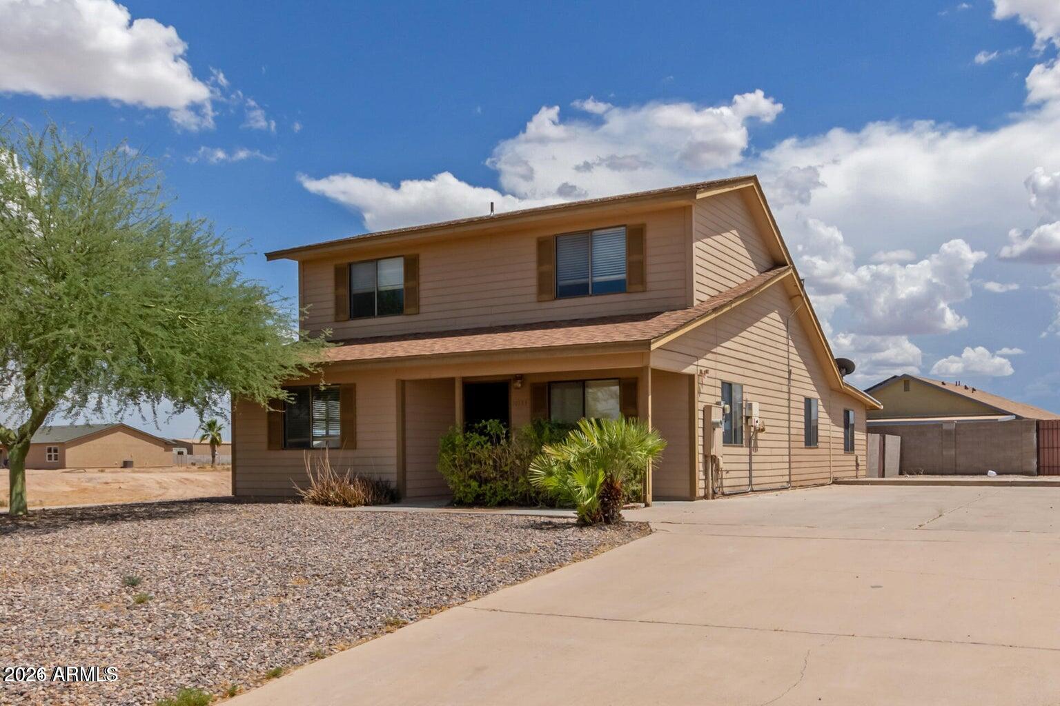 Looking for a new place to make home? You've just found the perfect one for you! Nestled on a corner lot, this 2-story home features RV gate parking and ample space for additional vehicles. Inside, find tile and wood-look flooring, a soothing neutral palette, and a welcoming living room. The spacious family room is perfect for gatherings, while the kitchen boasts wood cabinetry, granite counters, stainless steel appliances, and a serving window with a breakfast bar. Relax in the primary suite with a walk-in closet and private bathroom. The serene backyard with a paver patio is perfect for barbecues. NO HOA!