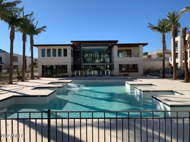 Penthouse level Villa Condominium with clear views of Camelback and Mummy Mountains. This open concept Villa is ready for personalization with a wide selection of luxurious finish level that is second to none.  Residents of The Ritz-Carlton Paradise Valley at The Palmeraie have access to an 8,000 square foot clubhouse building with a junior Olympic pool.  The Clubhouse has a movement studio full Techno Gym, a demonstration kitchen, boardroom with private patio, social gathering spaces and a concierge team.  Residents have access to the main hotel with 24-7 services of the Ladies and Gentlemen of The Ritz-Carlton.''