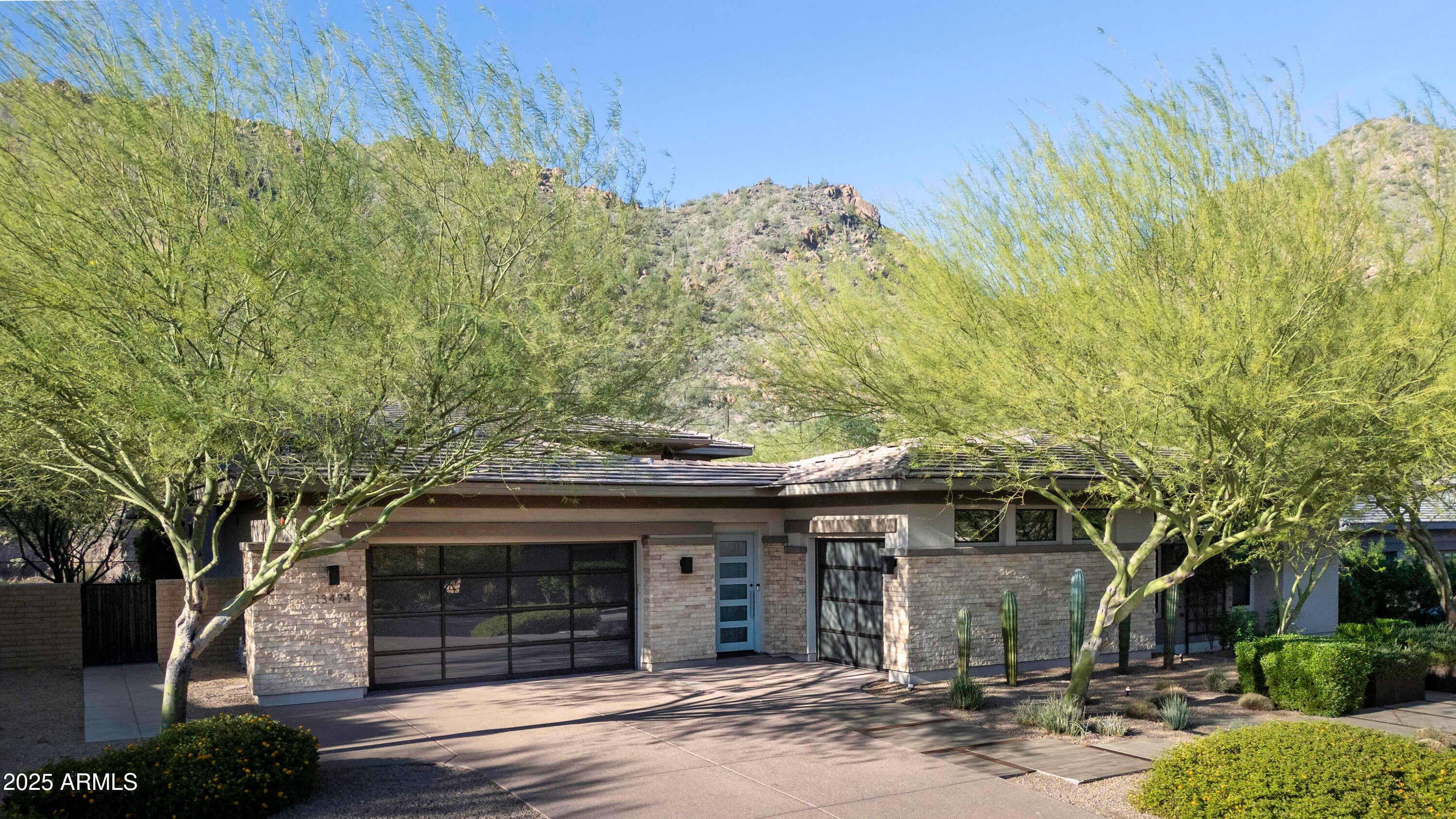 ANOTHER $150k PRICE ENHANCEMENT! Former Toll Bros. Model. N/S exposure. Enter the courtyard & step into your new home w/soaring ceilings, tons of natural light, wall to wall windows & pocket doors creating indoor/outdoor living at its finest. Main home has 3 bedrooms, 3 1/2 baths plus office & upgrades galore from designer light fixtures, quartz waterfall kitchen island, 5 burner gas range, rotisserie, Wolf appliances, Espresso machine, SubZero, 3 wine refrigerators, surround sound, Control 4 system, motorized shades, multiple accent walls & under cabinet lighting. Living/dining room has gas fplc & lighted wood accent feature wall. Casita w/add'l bedroom & bath & walk-in closet. Resort style backyard w/artificial lawn, heated pool w/waterfall & raised sun deck. AND... Covered patio w/tons of cabinets, granite counters, bbq, side burner, sink, dining table & beverage frig. Great for entertaining. Primary retreat & bath w/a private patio, outdoor shower & spa. Primary bath features dual sinks, spacious shower and walk-in closet w/built-in dressers & shelves. Separate family room features built-in cabinets w/open shelves & sliding doors to front courtyard. It can also create a separate guest area for privacy. Secondary bedrooms are both en-suite and split from primary bedroom. 3rd bedroom currently used as a 2nd in-home office. Laundry room with sink. 3 car garage with built in storage closets and EV hook-up. 3624 Square feet includes a 374 square foot guest casita. Gated community. All this and more. A Must See! Show & Sell.