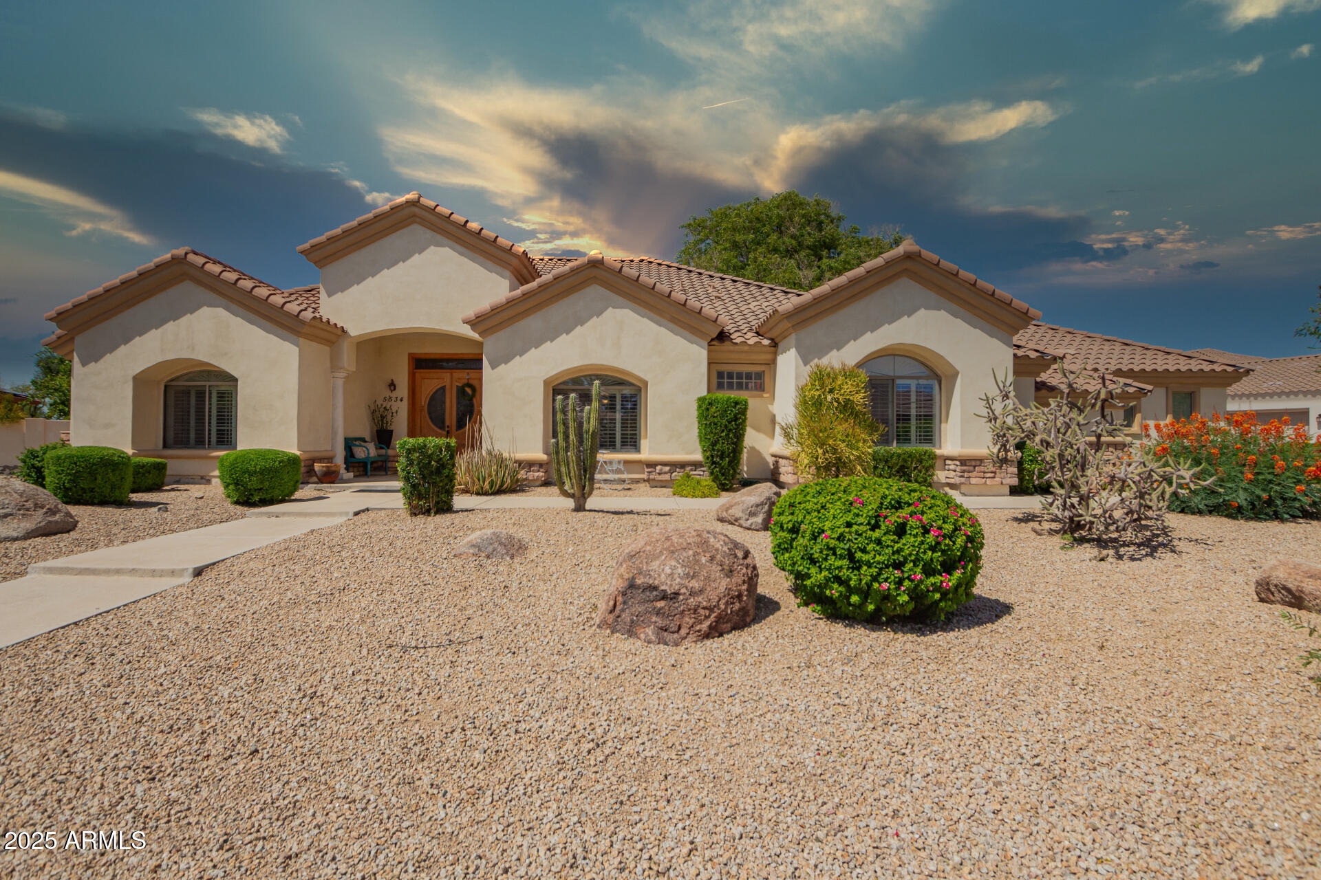 Welcome to this stunning custom-built residence in the desirable Riviera Drive Estates in Glendale, Arizona. This meticulously designed home offers the perfect blend of luxury, comfort, and functionality. Step inside to find a spacious floor plan featuring two cozy fireplaces, perfect for relaxing evenings or entertaining. The heart of the home is a true chef's kitchen, with double ovens,  center island, granite countertops, and ample cabinetry—ideal for culinary enthusiasts. Step outside to your backyard retreat complete with a sparkling pool and plenty of space for gatherings. This home also features a 3.5-car extended garage with storage space and an RV gate, catering perfectly to Arizona's outdoor lifestyle. No detail has been overlooked in this one-of-a-kind gem. One or more photos have been virtually staged to show different decor.