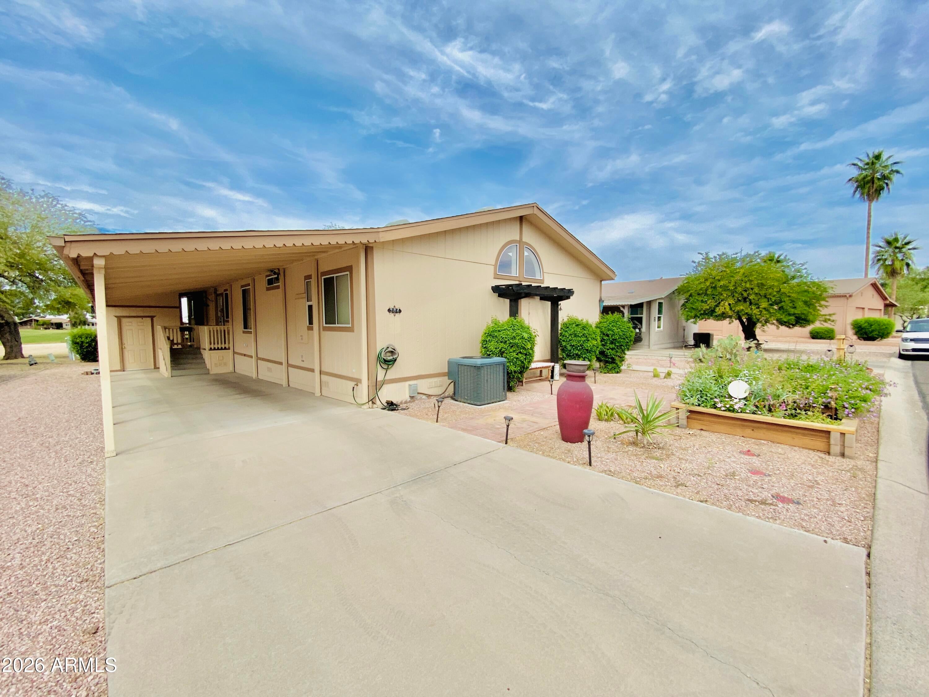 WOW!!! A GOLF COURSE LOT rarely becomes available in Pinnacle Peak West, a 55+ gated community near Desert Ridge. Your retirement dream comes true in this beautifully updated 2 bed + den, 2 bath home with remodeled kitchen, granite countertops, farmhouse sink, double oven, vaulted ceilings, skylights, wrapping deck, w/golf cart included! New landscaping w/tranquil seating and raised irrigated garden box. HVAC 2021. Monthly land lease $1065 covers W/S/G & the 24/7 manned guard gate, 9 hole golf course, pickleball, basketball, cornhole, heated pool & hot tub, new pergola, game room, clubhouse & classes. Park application & bkgrd ck req'd $40 ea. 2 dog max of 30 lbs, no rentals allowed/only owner occupied. Owner willing to offer patio furniture & outdoor heater if desired.