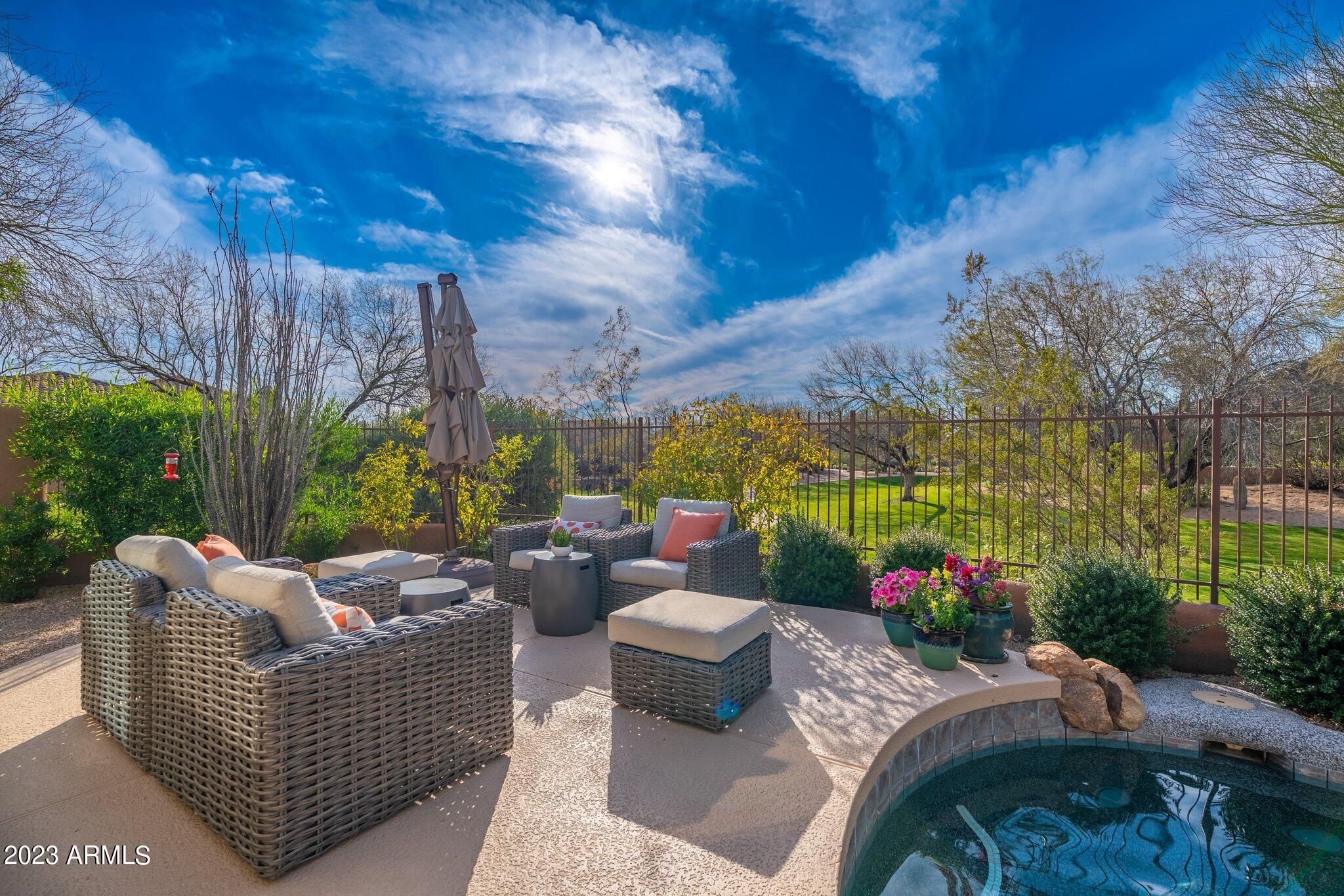 A perfect gem in the heart of the Desert Camp neighborhood in DC Ranch. Custom finishes have been added to this 2,500 sq. ft. home. New Kitchen in 2017, New owners suite bathroom in 2021. Hardwoods floors in all the living spaces. The home is situated on a corner lot and backs to a large community park. Views , sunsets, and a setting  that makes you feel you are living on acreage. The path and trail system is right outside your door. The Desert Camp recreational center is a short 2 minute walk with tennis, pickle ball, heated pools, workout facility and social activities. This is a must see.