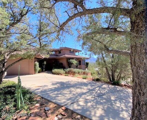 VIEWS! VIEWS! VIEWS! VIEWS!  Get the point? V.I.E.W.S!  Original Owner had this beauty custom built and took advantage of perching this 2626 square foot, 3 Bedroom home way high up on a hill overlooking uptown to take advantage of the VIEWS!  High Vaulted Wood Ceilings in the Main Room!  Kitchen, Primary Suite, 3/4 bath, office, additional Study (think bedroom) and a 3 car garage make up the main living area.  2nd Floor boasts 2 Bedrooms, Outdoor Covered Deck and a Full Bath. Primed for a Remodel this exceptional home on this exceptional lot is without a doubt one of the BEST View Homes you will see. Sewer, Natural Gas,  Outdoor Shed and within distance to Uptown Sedona.  No HOA so the possibilities are endless!