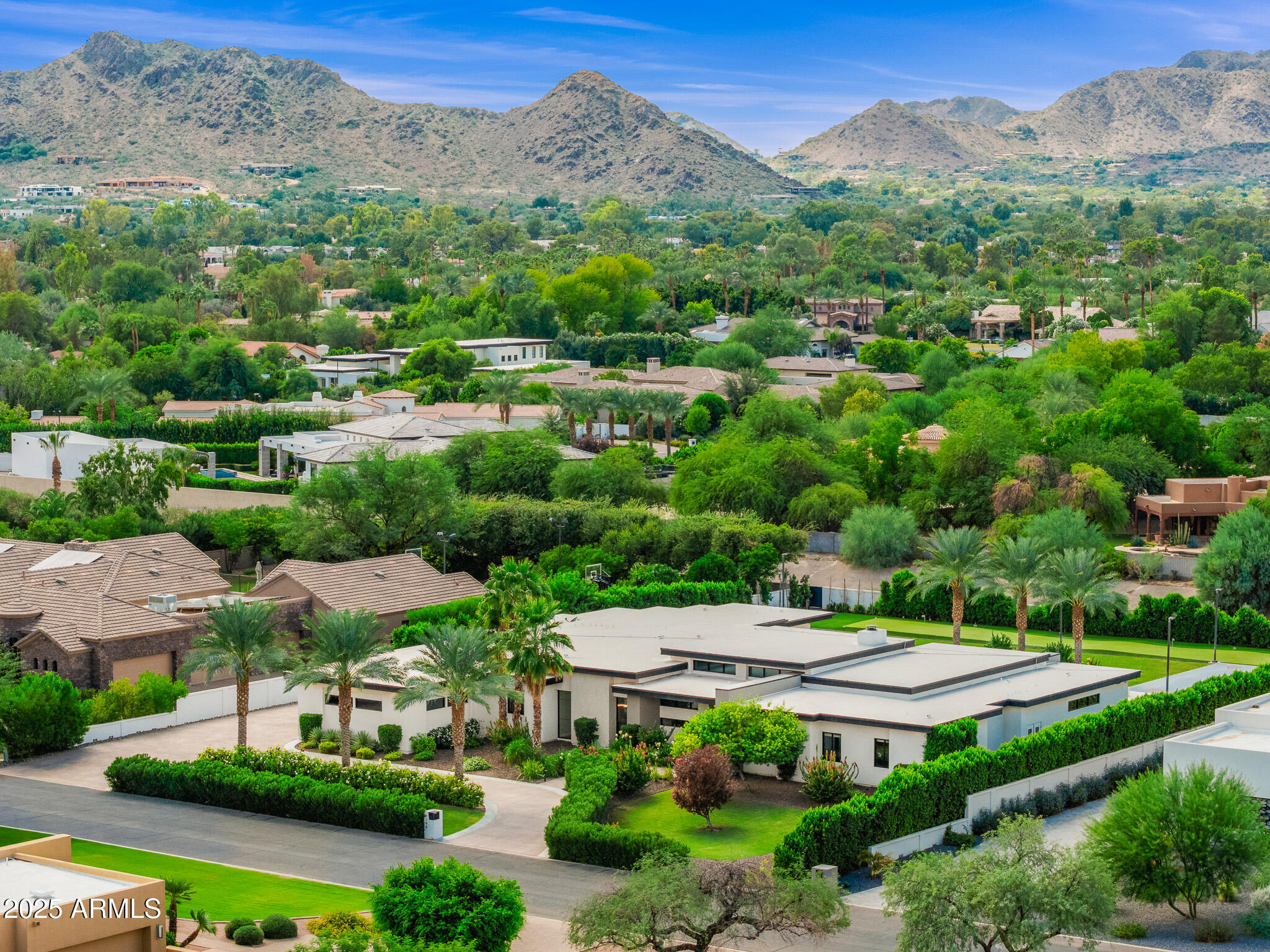 This modern estate is a striking showcase of architectural sophistication and refined living newly constructed in 2018. Featuring 5 bedrooms, a dedicated office, and an expansive game room, the single-level floor plan seamlessly blends sleek contemporary design with natural, organic textures. The result is a tranquil sanctuary nestled in one of Paradise Valley's most prestigious neighborhoods.A single-level open concept blends sleek contemporary lines with organic warmth, creating a serene retreat in the heart of Paradise Valley's most coveted enclave. Thoughtfully designed for effortless indoor/outdoor living, every detail has been curated to elevate both daily life and grand-scale entertaining.