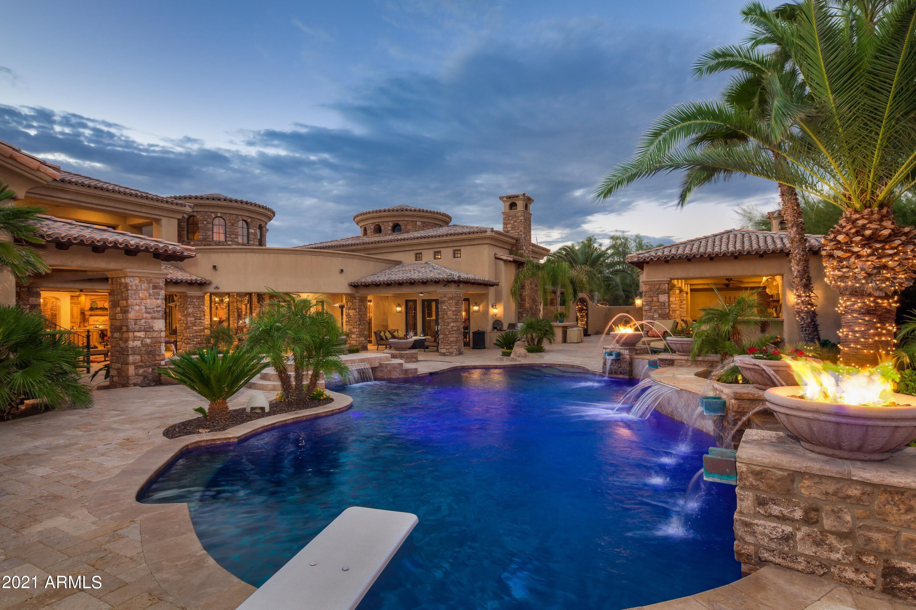 This spectacular estate situated on nearly an acre is absolutely exquisite. Designed as a luxury compound, there is no reason to leave home. Enter your private gated drive into the cobblestone courtyard and you're ushered into luxury. The main home is nearly 9000 sq.ft. with 6 bedrooms- all en suites with their own patios or balconies, 5 car garage, a spectacular gourmet kitchen with double islands, family room with 18-foot ceilings, formal living room with French doors, formal dining, huge game room, elegant wine tasting room, 5 fabulous fireplaces, large movie theatre, large home office with conference table, homework station, multi-sport court, beautiful pool and spa with fire features, large guest house with a sauna, a steam room and workout room, a huge putting green, the large loggia includes an outdoor bar, TV room with fireplace and game room, plus all the high tech bells and whistles to run a home this grand at the touch of a button. Absolutely stunning from floor to ceilings! Great location in 85259, just 15 minutes either way to Old Town, Kierland, and Scottsdale Quarter.  WHEW!! Arizona Luxury Living at its finest. This one is a jaw-dropper!