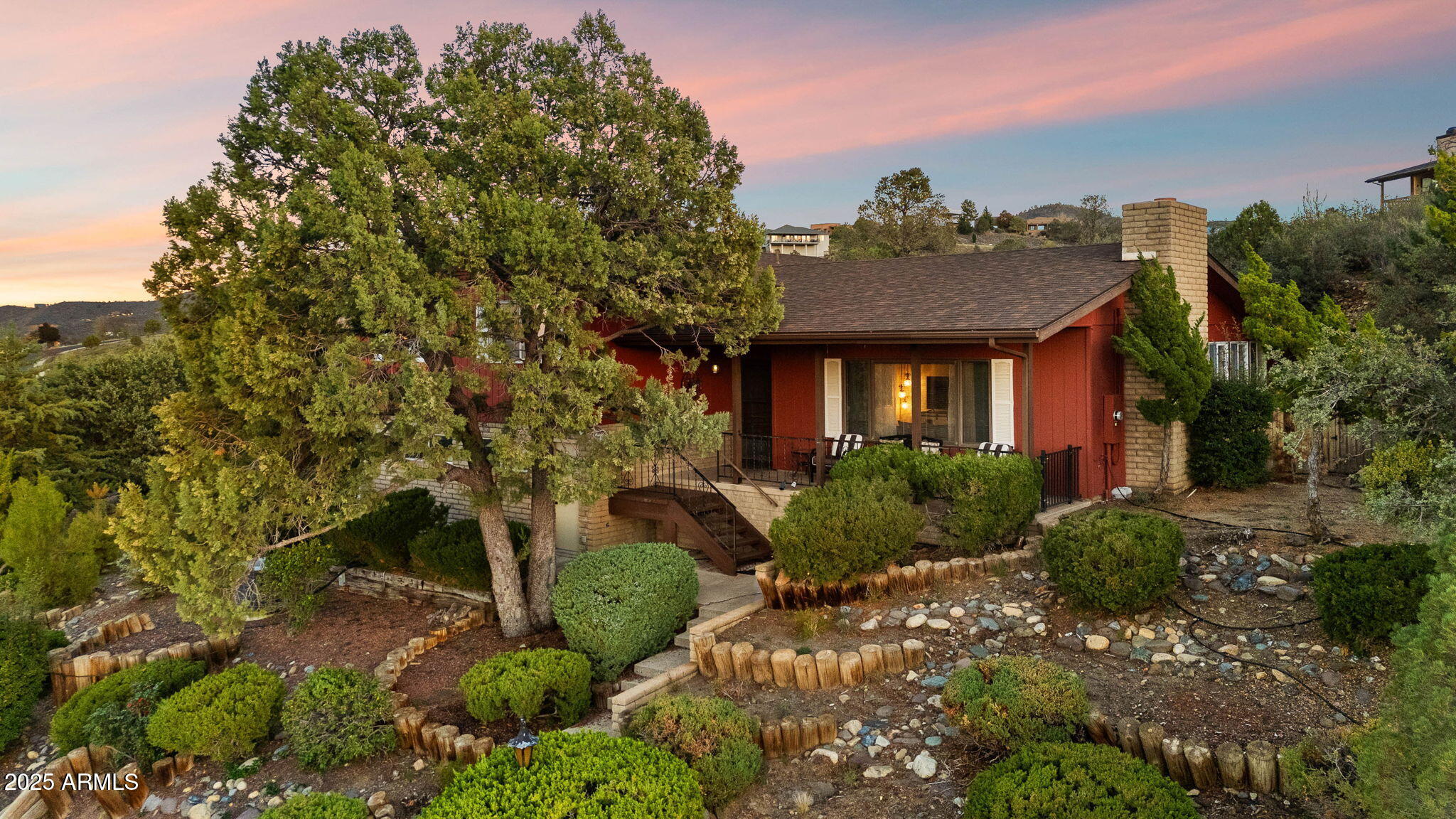 Nestled on over half an acre corner lot with sweeping views of the Prescott mountains, this charming 4-bedroom, 3-bath split-level home is just a mile from downtown. A cozy living room features a wood-burning fireplace & built-ins, while the newly added recreation room dazzles with floor-to-ceiling windows. The updated kitchen features modern appliances & ample counter space while the spacious primary suite offers a lounge area, walk-in closet, & ensuite bath. Upstairs & downstairs bedrooms provide flexible living options, perfect for multi-generational living. Outside, the landscaped multi-level yard invites relaxation & entertaining. This expansive property includes an additional parcel, generous parking, a two-car garage, RV space, a new 2023 roof, & $30K in upgrades. Don't miss out!