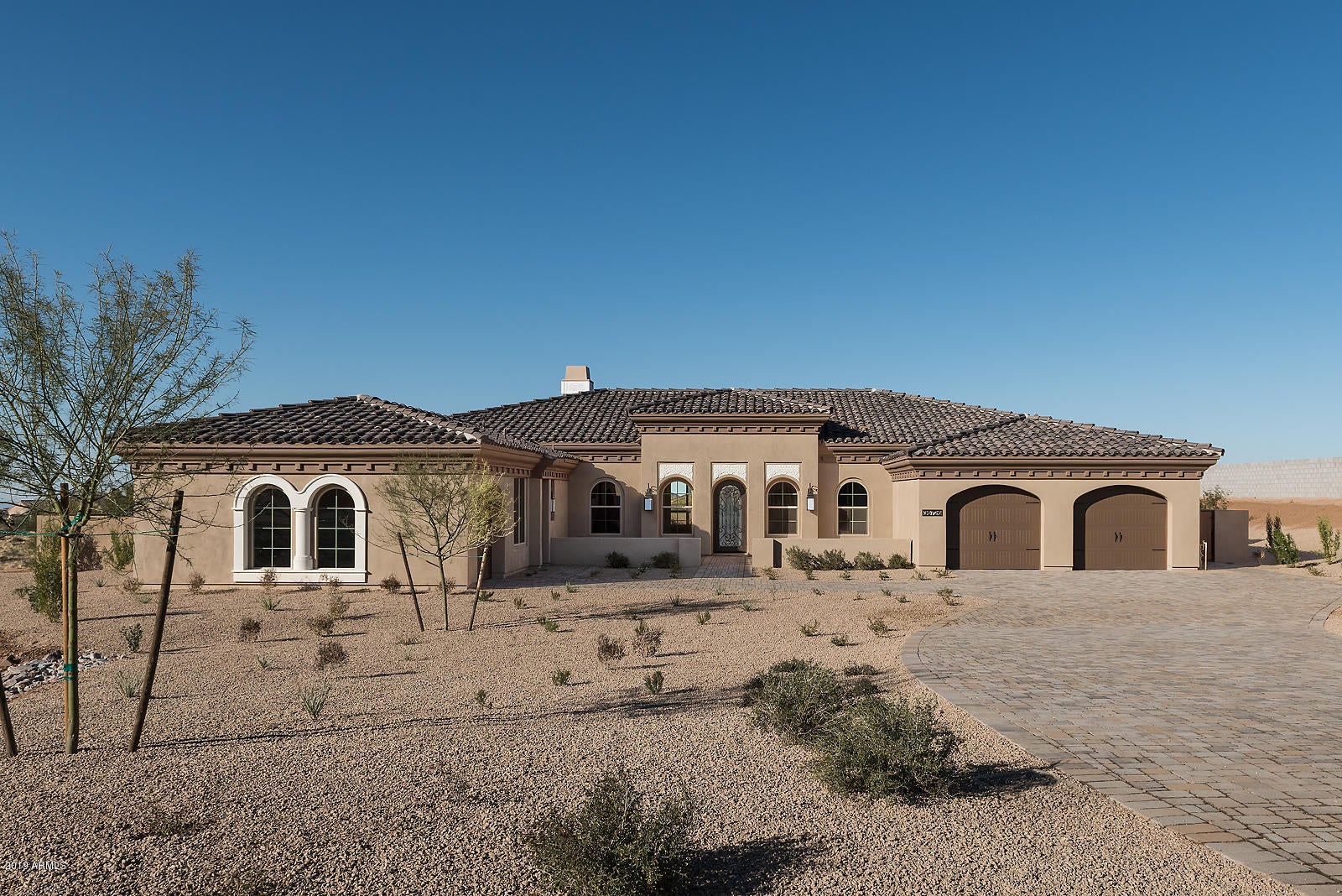 This fabulous 4,448 square foot luxury 1-story home on 1+ acre lot with wonderful mountain & city light views just completed 12/27 in the exclusive gated Rosewood Summit Estates in Scottsdale. This unique move-in ready Great Room designed home provides indoor/outdoor living w/ full landscaping, BBQ, Fire Pit & resort pool. Professionally-designed interiors include wood flooring, custom front door, 12 to 15 ft ceilings, expansive View windows, custom Marble fireplace, ceiling beams, Restoration Hardware Forged Iron lighting, dual access Casita with bath, wonderful Master Suite, large ensuite Bedrooms, Den, Oversized 3-Car Garage plus Gourmet Kitchen w/ custom cabinetry, gorgeous marble, Wolf ProStyle Gas Range, 48'' SubZero Ref/Freezer, ASKO Dishwasher, furniture style island & more.