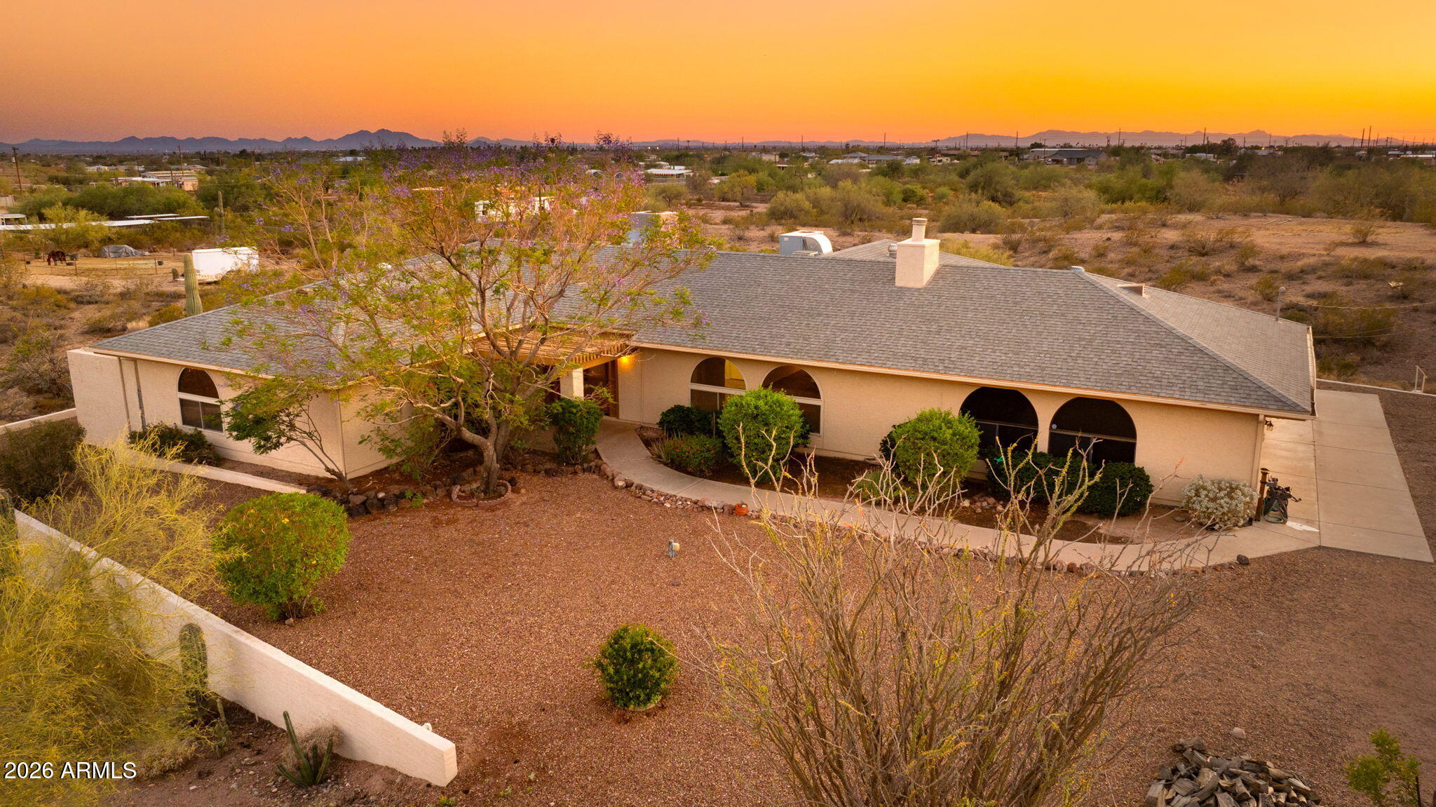 Out where the desert opens up and the horizon never feels crowded, Apache Junction delivers a lifestyle that's hard to replicate. Framed by the legendary Superstition Mountains and surrounded by miles of open land, this is where space, freedom, and everyday living come together in a way you simply don't see often--especially when it comes with nearly 4.7 acres to make your own. This property gives you room to breathe, room to expand, and views in every direction that remind you exactly why people are drawn to this part of Arizona. The layout is spacious and comfortable, designed to flow easily from one space to the next while capturing natural light and those wide-open desert vistas.

The kitchen stands out as a true centerpiece of the home, offering endless cabinet and counter space that makes it as functional as it is inviting. Corian countertops provide a clean, durable work surface, while the abundance of storage keeps everything organized and within reach ideal for everyday living or hosting on a larger scale.

Throughout the home, newer tile flooring adds durability and style, while the remodeled bathroom brings a fresh, updated feel. The primary suite is oversized with a massive closet that handles everything with ease. Secondary bedrooms are equally well-sized, each with large closets that add to the home's practical design.

Dual pane windows help with efficiency, while a wood-burning stove adds warmth and character during cooler desert evenings. All appliances are included, making this a move-in ready opportunity without the extra steps.

Step outside and the possibilities really start to unfold. With nearly 4.7 acres, there's flexibility here that's getting harder to find--whether that means creating additional space for toys, animals, outbuildings, or exploring the potential for subdividing.

Opportunities like this tend to get claimed quickly, and this one is ready for its next chapter.