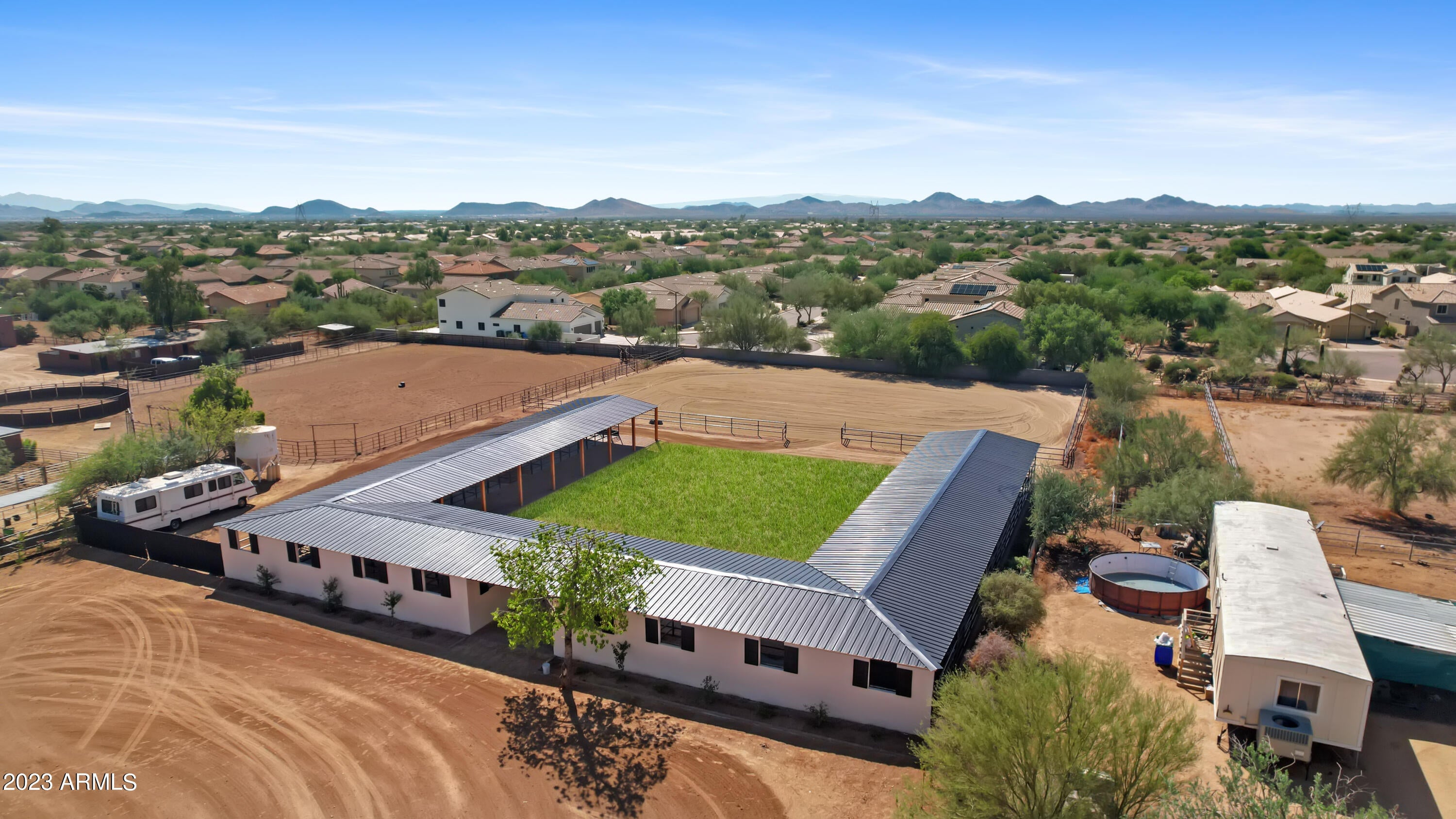 Welcome to the ideal Arizona Ranch, This property features a  beautiful  single level home with 3 bedrooms 2 bathrooms a sparkling pool and private yard plus a new roof.  The ranch area features a brand new 24 stall barn, large new arena 80x120 and property has room to add a round pen or more turnouts. The separate casita has a full kitchen and bath. This ranch is located at the end of 53rd street a very private, very equestrian friendly neighborhood and the best part... CITY WATER and PAVED ROADS TOO!