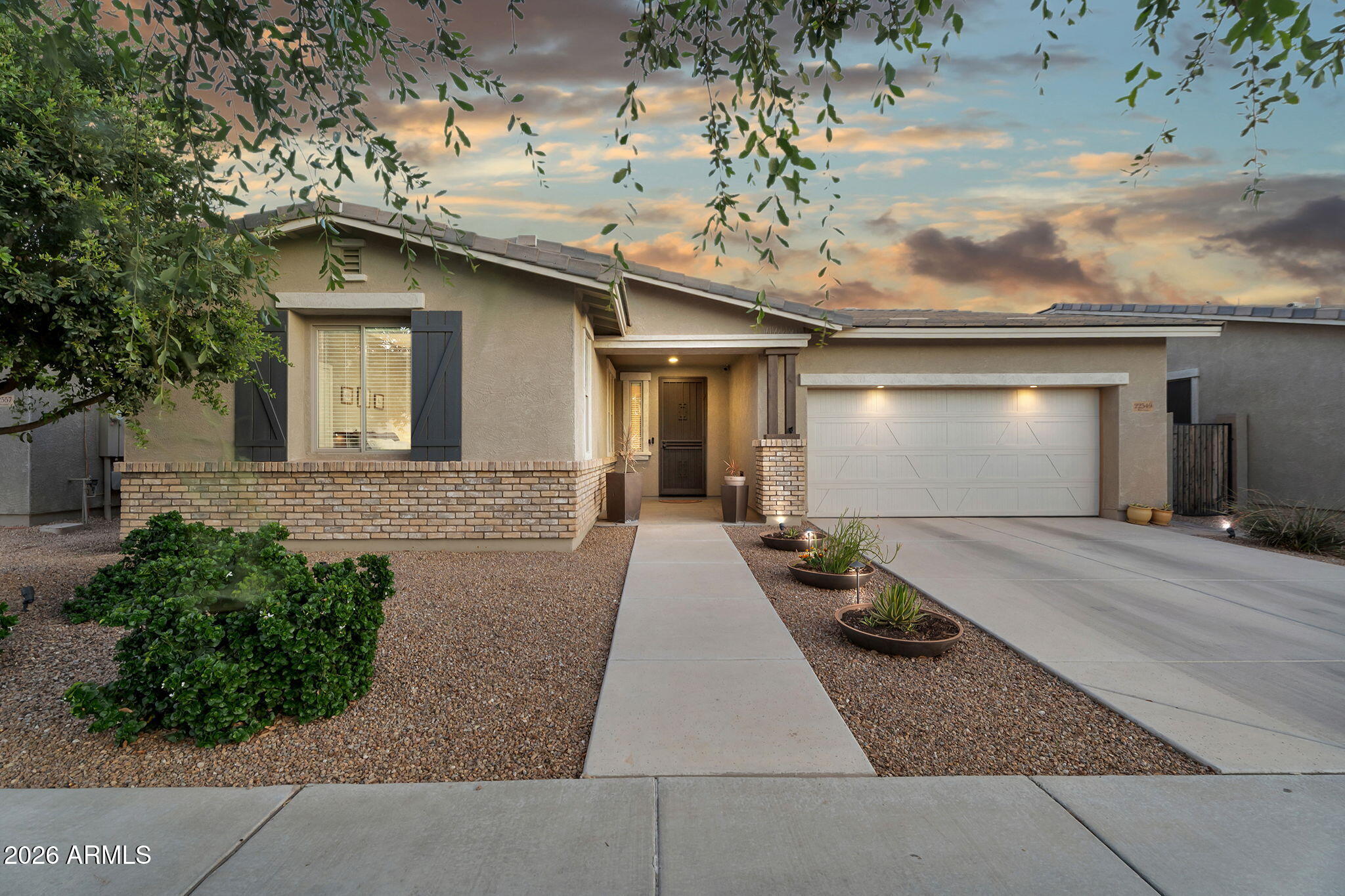 Single-level living at its best. This 3-bed + den 2-ba home in Queen Creek delivers 2,061 sq ft w/ 10' ceilings, split floor plan & a backyard built for Arizona living. The heated & chilled pool is surrounded by lush landscaping, a covered patio w/ swivel-mount TV, built-in natural gas grill, and a gas fire pit -- a true outdoor room, usable year-round. Inside, the kitchen features a gas range, 42'' cabinets w/ Bluetooth ambient lighting & an open layout. The den is flexible as a home office or second living space. Laundry room incl custom built-ins that match the rest of the home. Secondary bedrooms feature walk-in closets. Community offers pool, green spaces, basketball court & playground. Easy commuter access, top rated schools + nearby local features like Schnepf Farms & QC Olive Mill. Efficiency upgrades include a tankless water heater and whole-home RO and soft water system. Large double slider doors flood the interior with natural light. A park is just steps away -- open green space, no equipment. Built in 2016 with no steps and true single-level accessibility. This is the only pool home available under $625k in this neighborhood.  3 TVs included, plus barstools.  A home that lives larger than it looks.